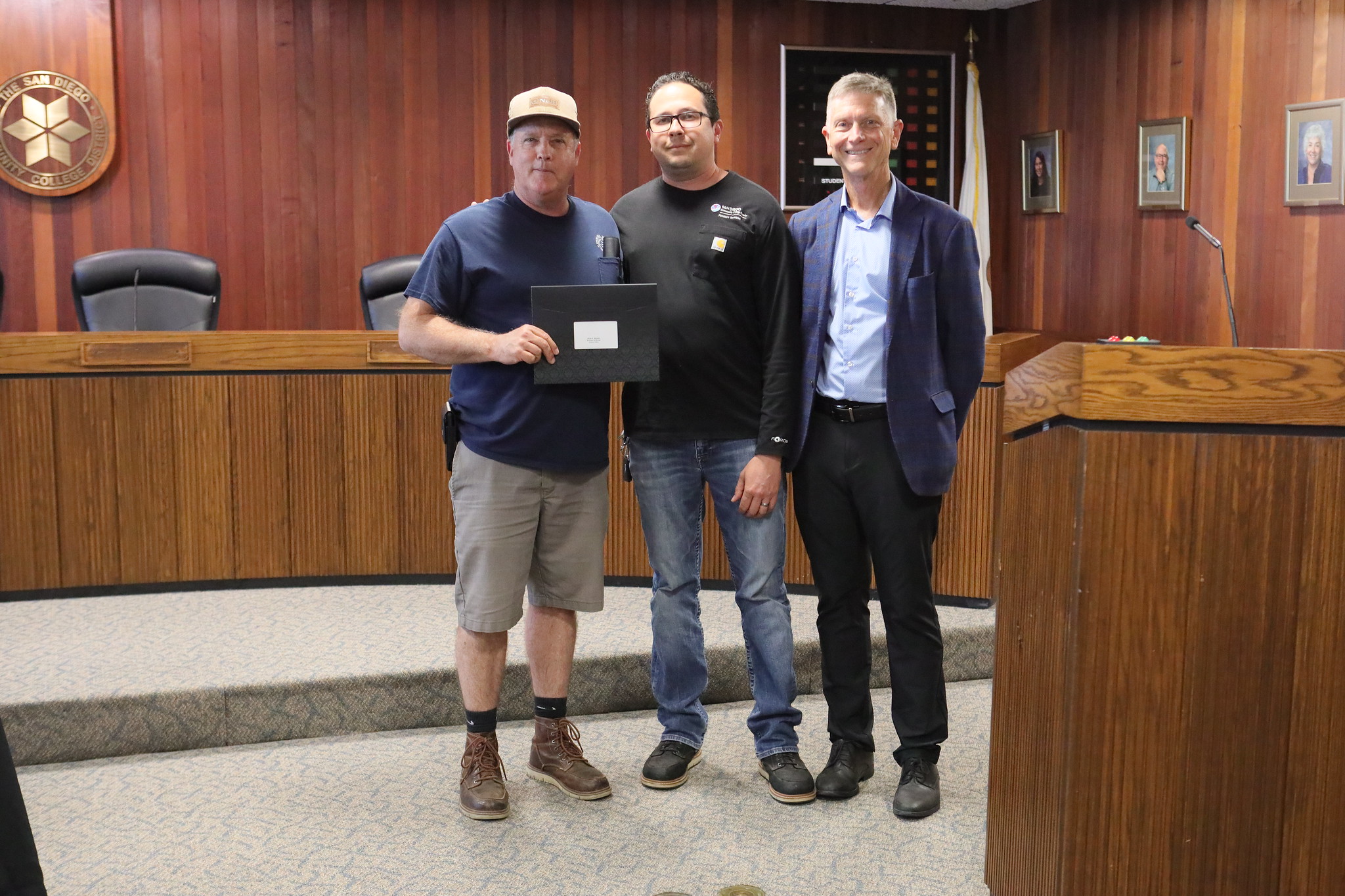 
Three people at the service awards event
