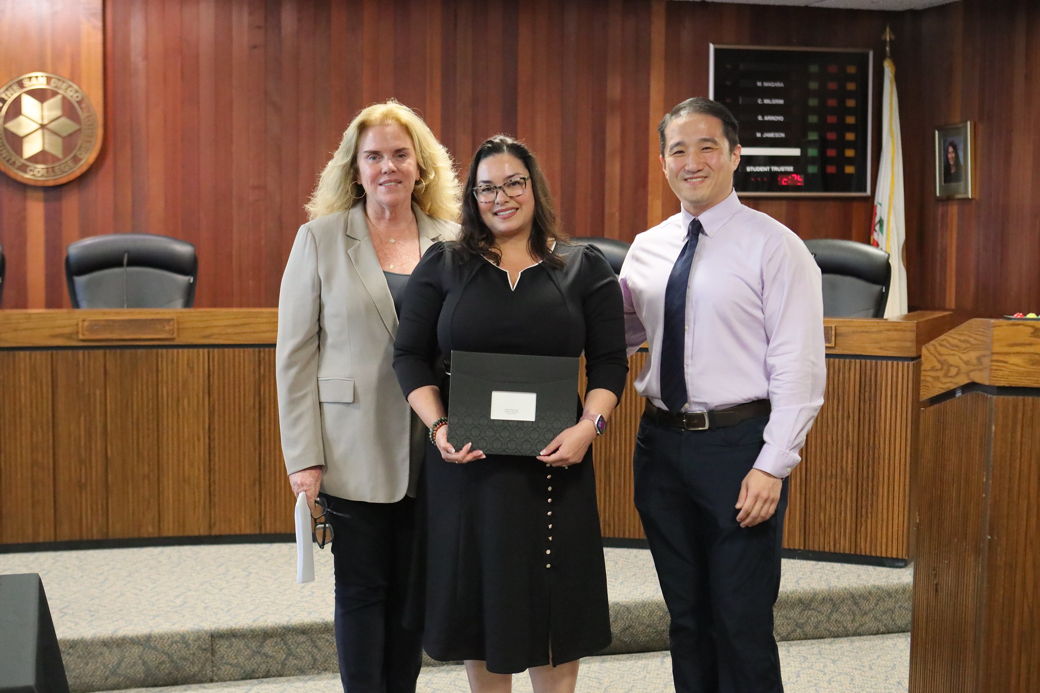 
Three people at the service awards event
