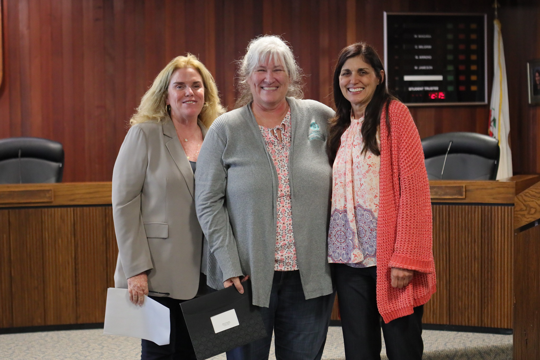 
Three people at the service awards event
