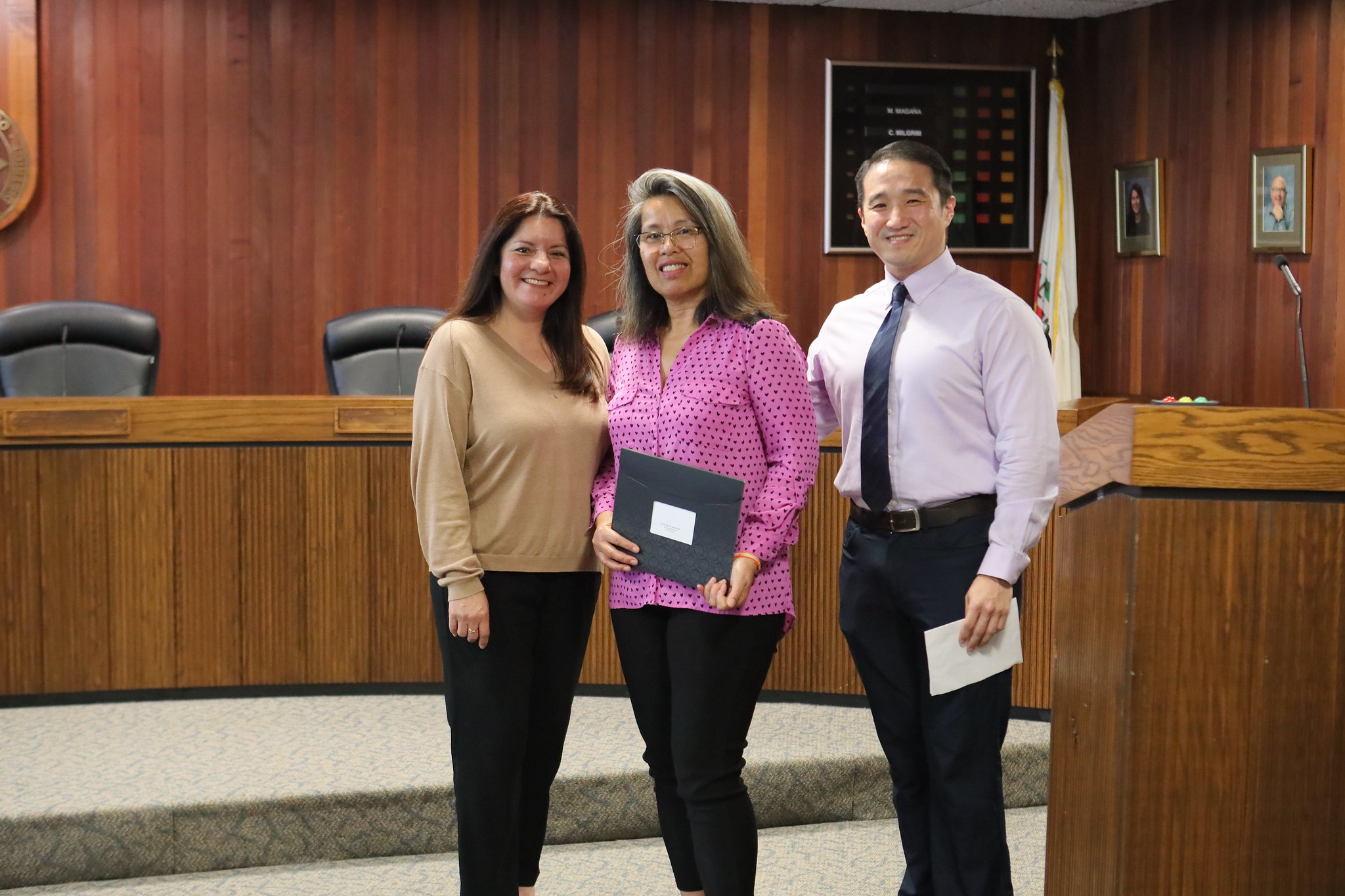 
Three people at the service awards event
