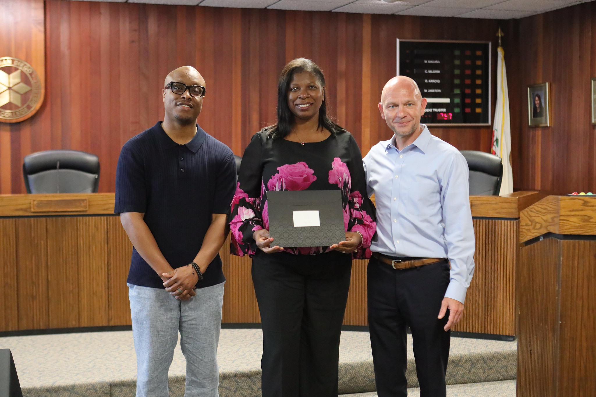 
Three people at the service awards event
