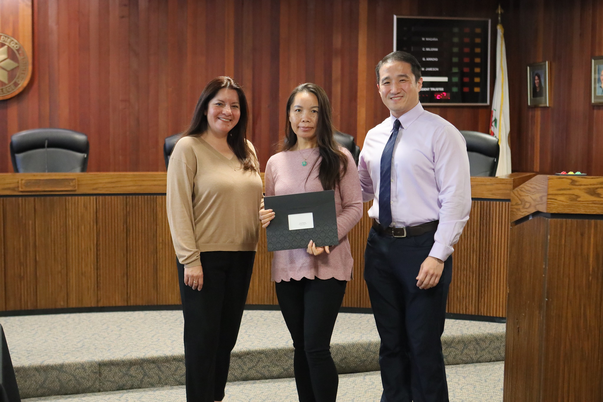 
Three people at the service awards event
