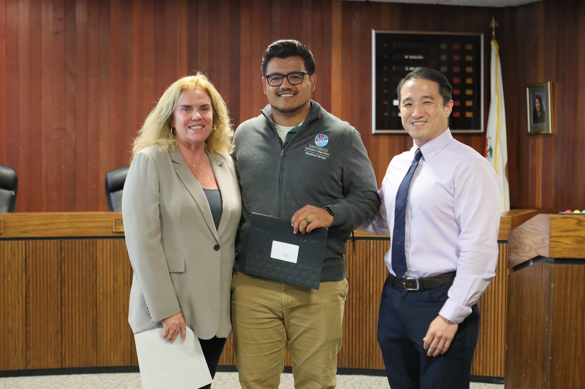 
Three people at the service awards event

