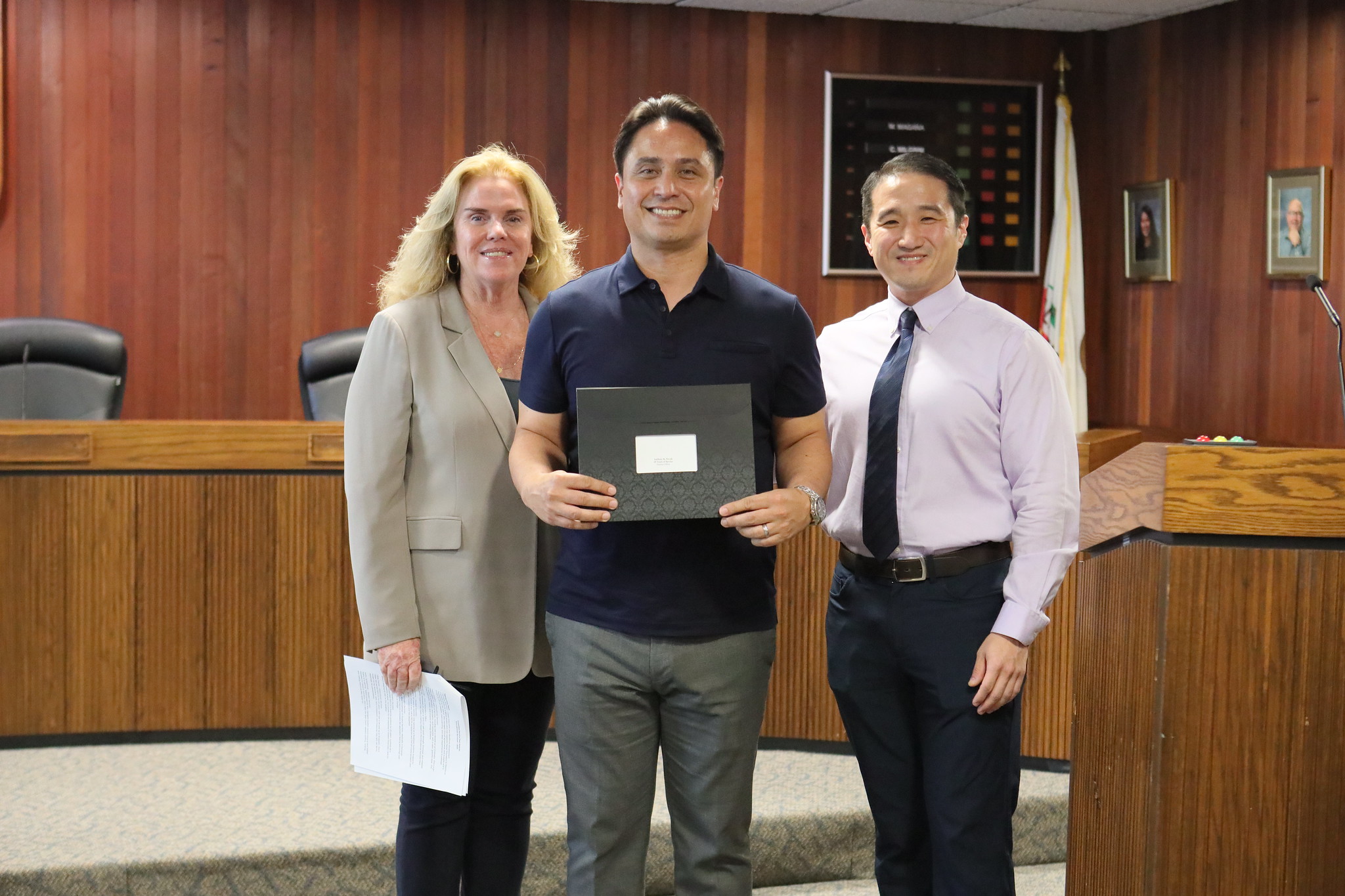 
Three people at the service awards event
