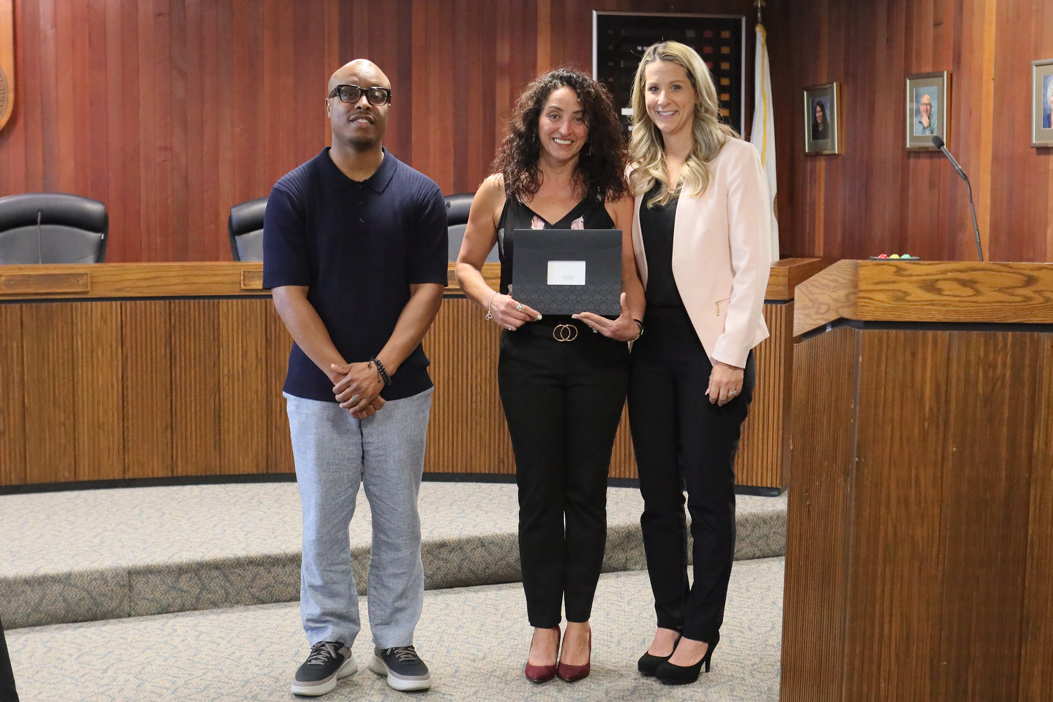 
Three people at the service awards event
