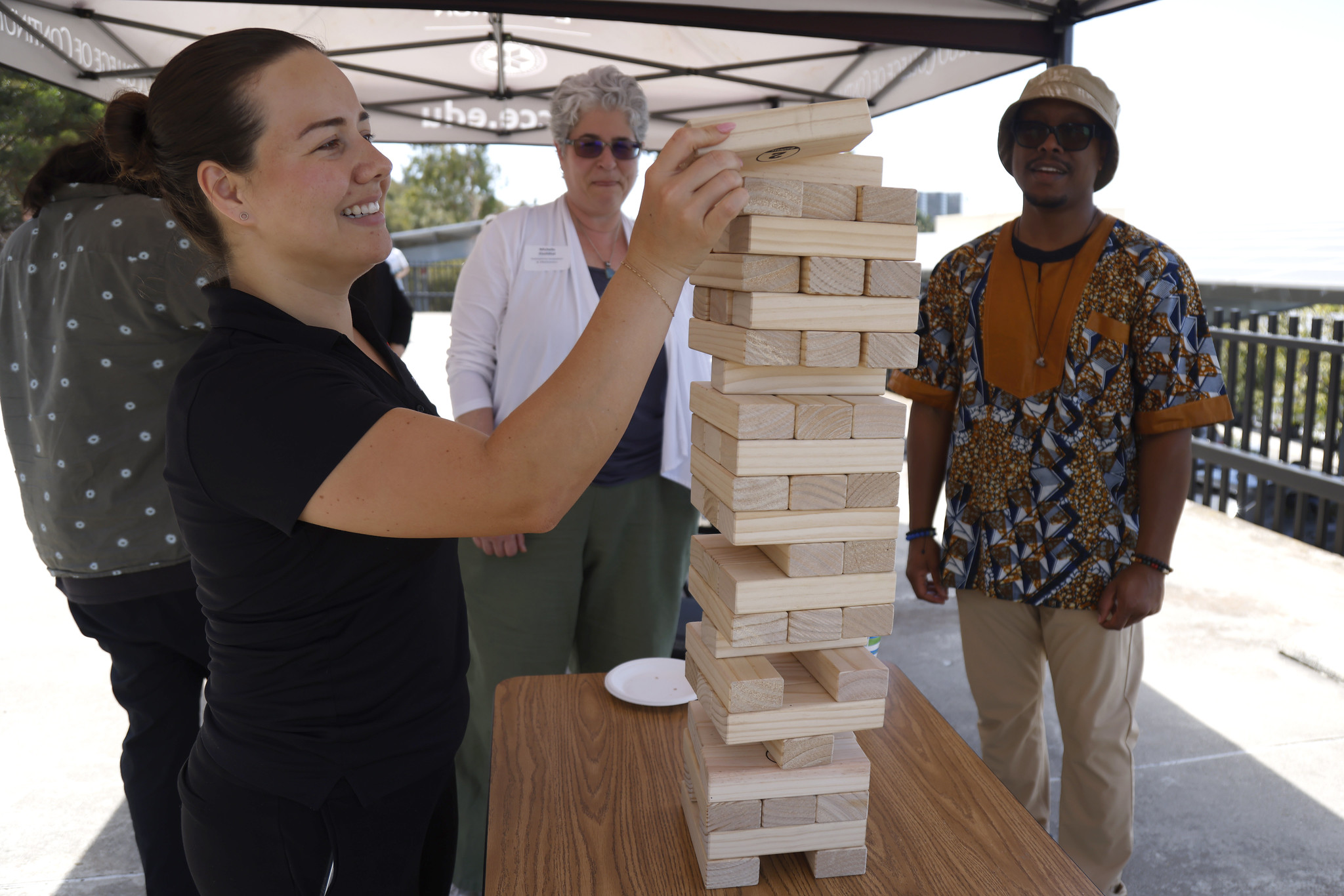 
An employee starts a game of Jenga.
