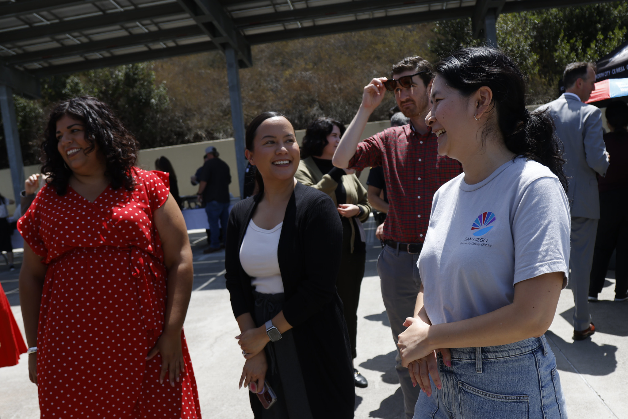 
Employees watch people playing games.
