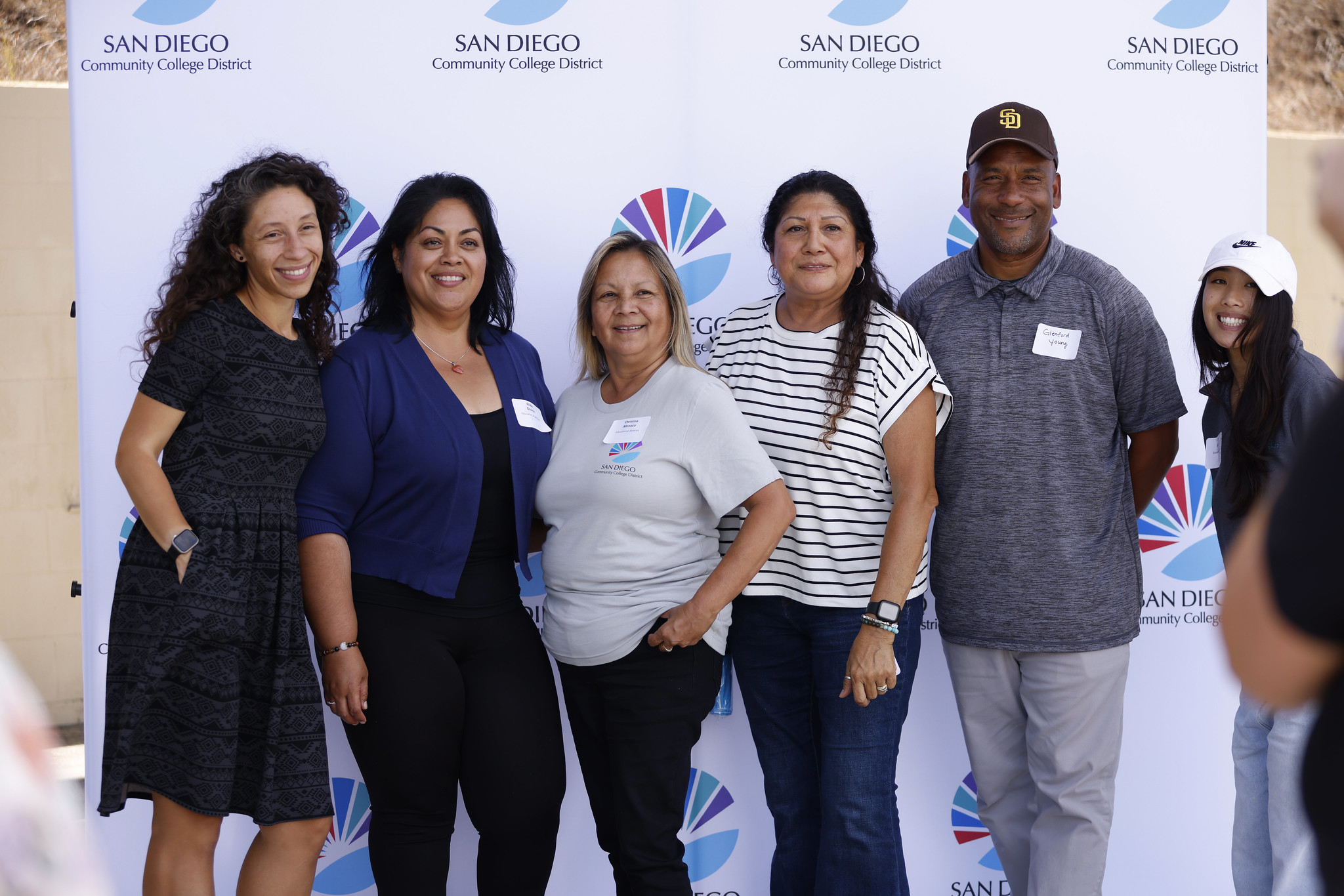 
Six employees take a group photo.
