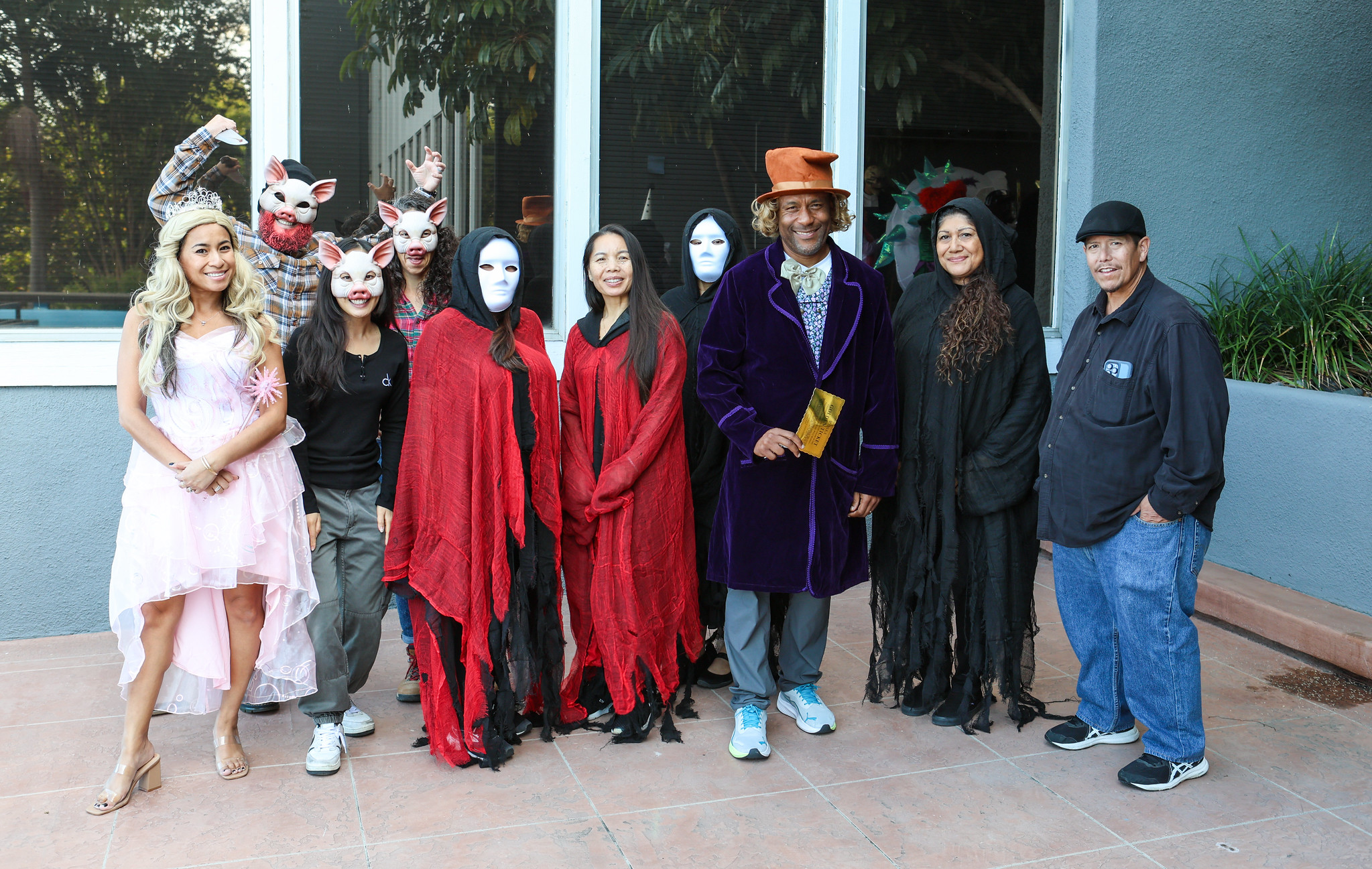 
10 people in various Halloween costumes at the District Office.
