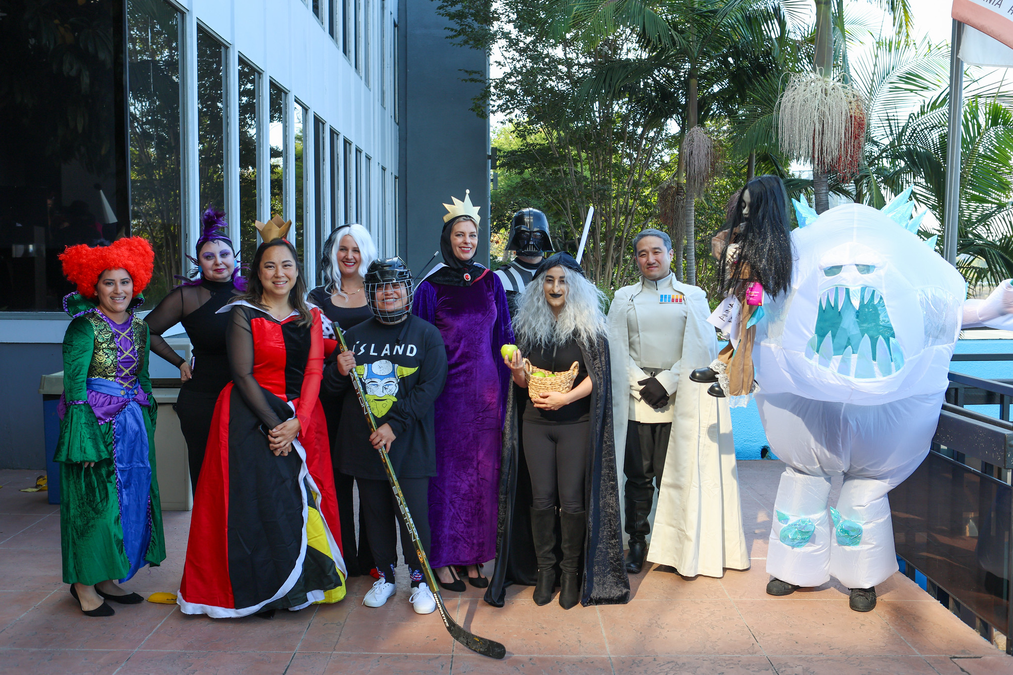 
11 people in various Halloween costumes at the District Office.
