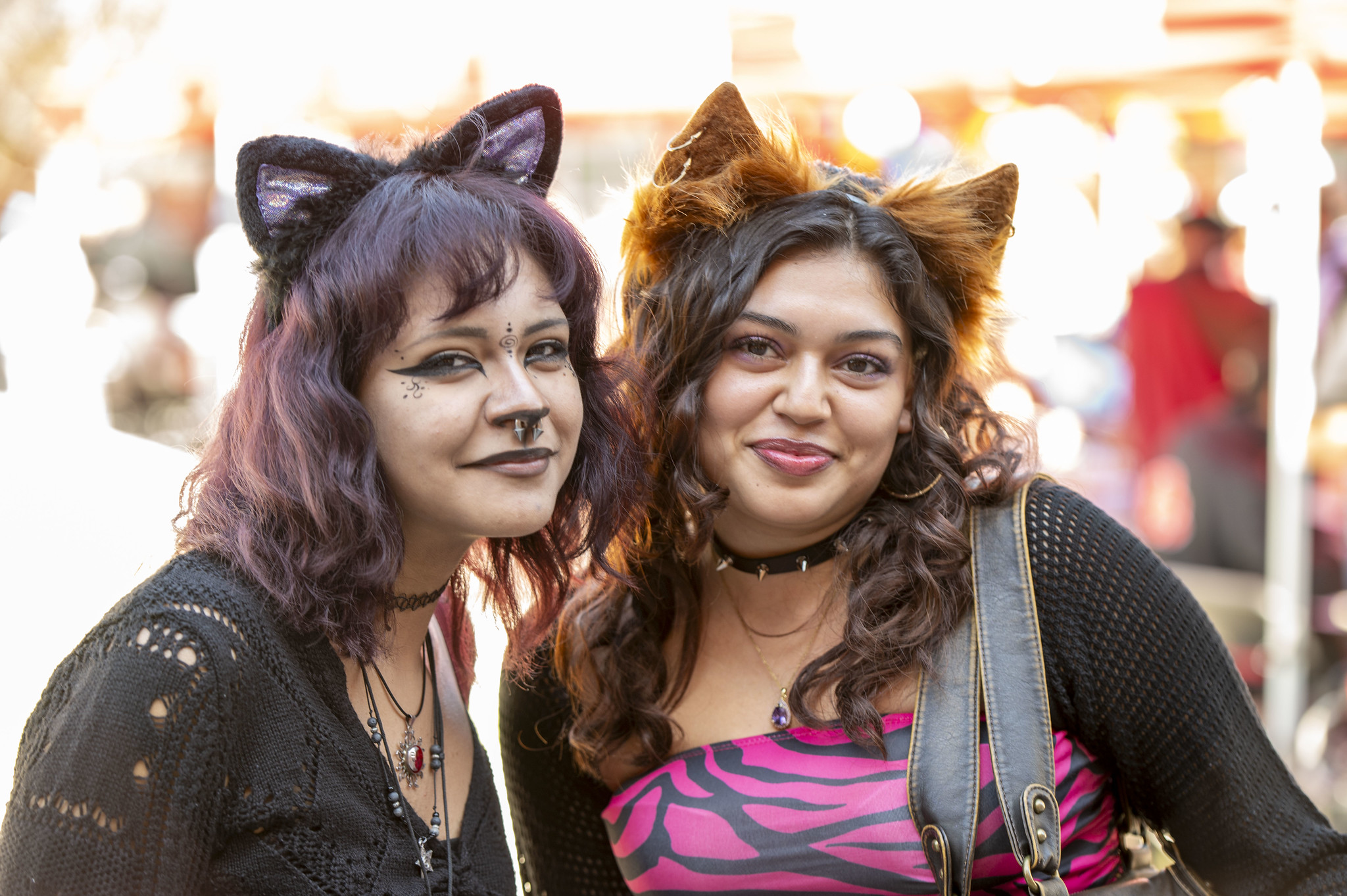 
Two ladies dressed as cats.
