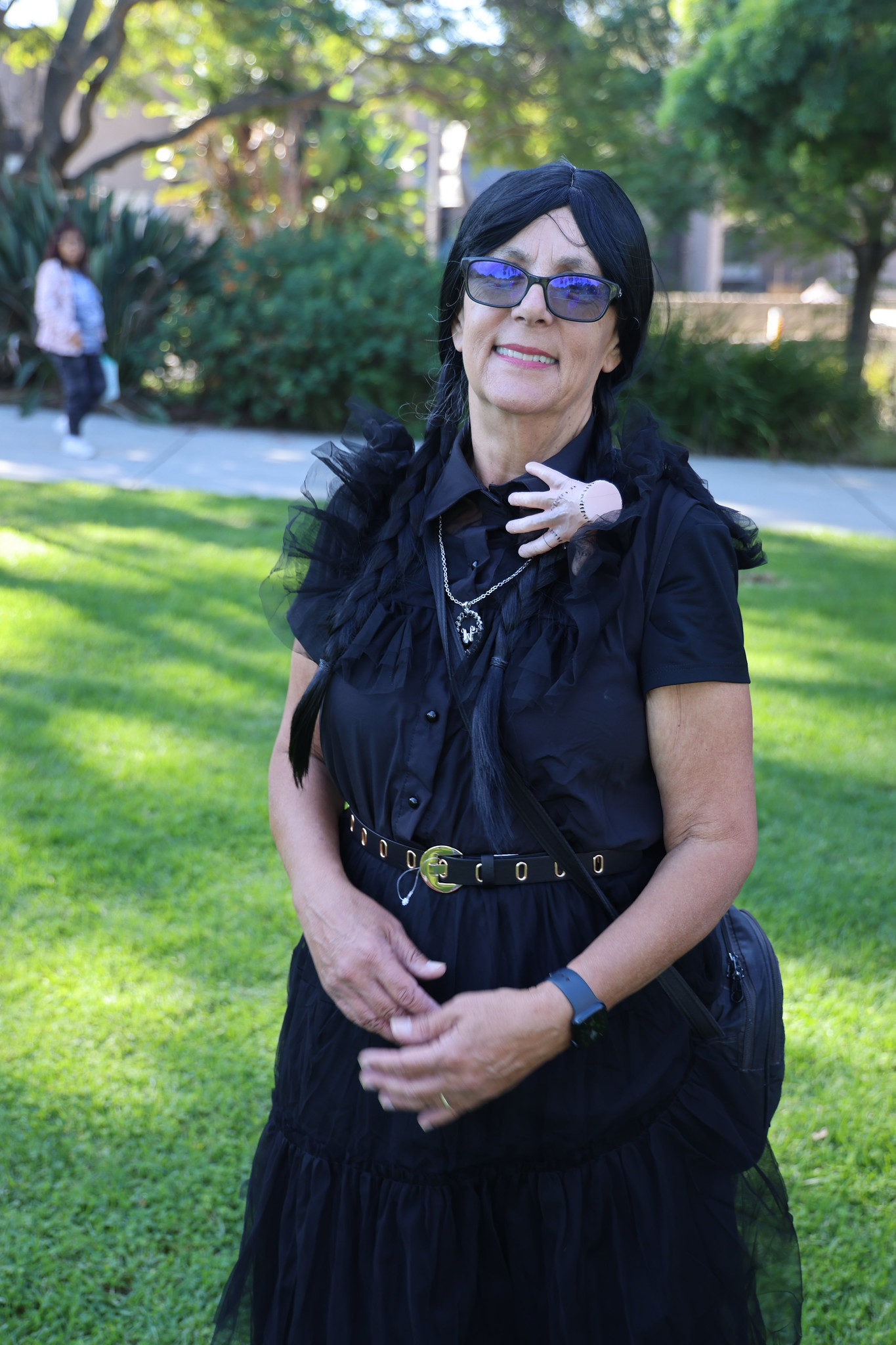 
A woman dressed as Wednesday Addams.
