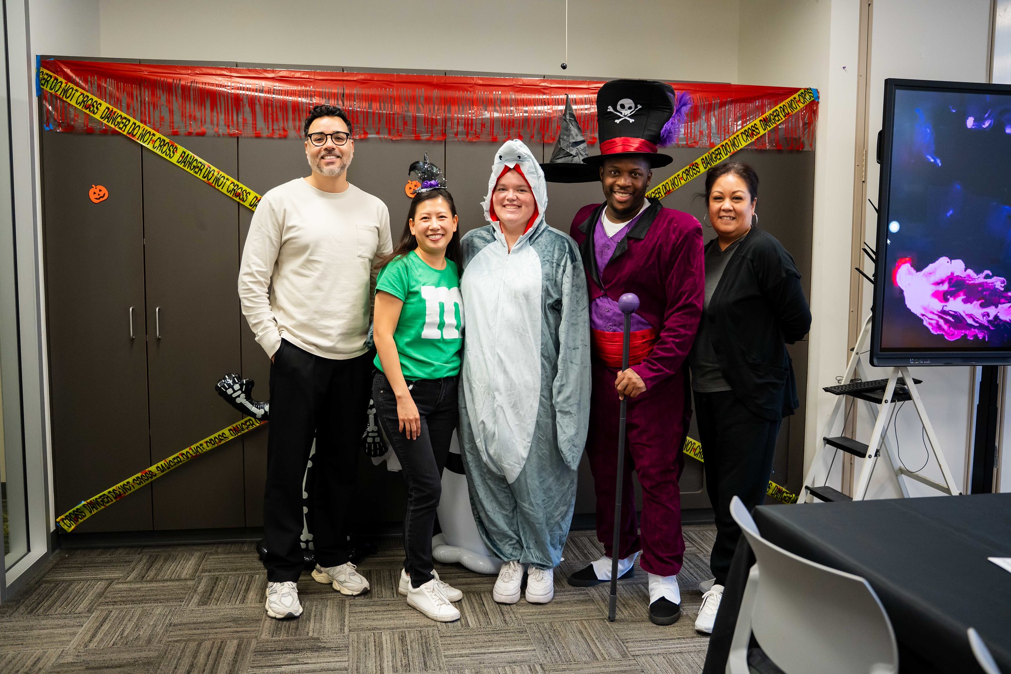 
Five people in Halloween costumes
