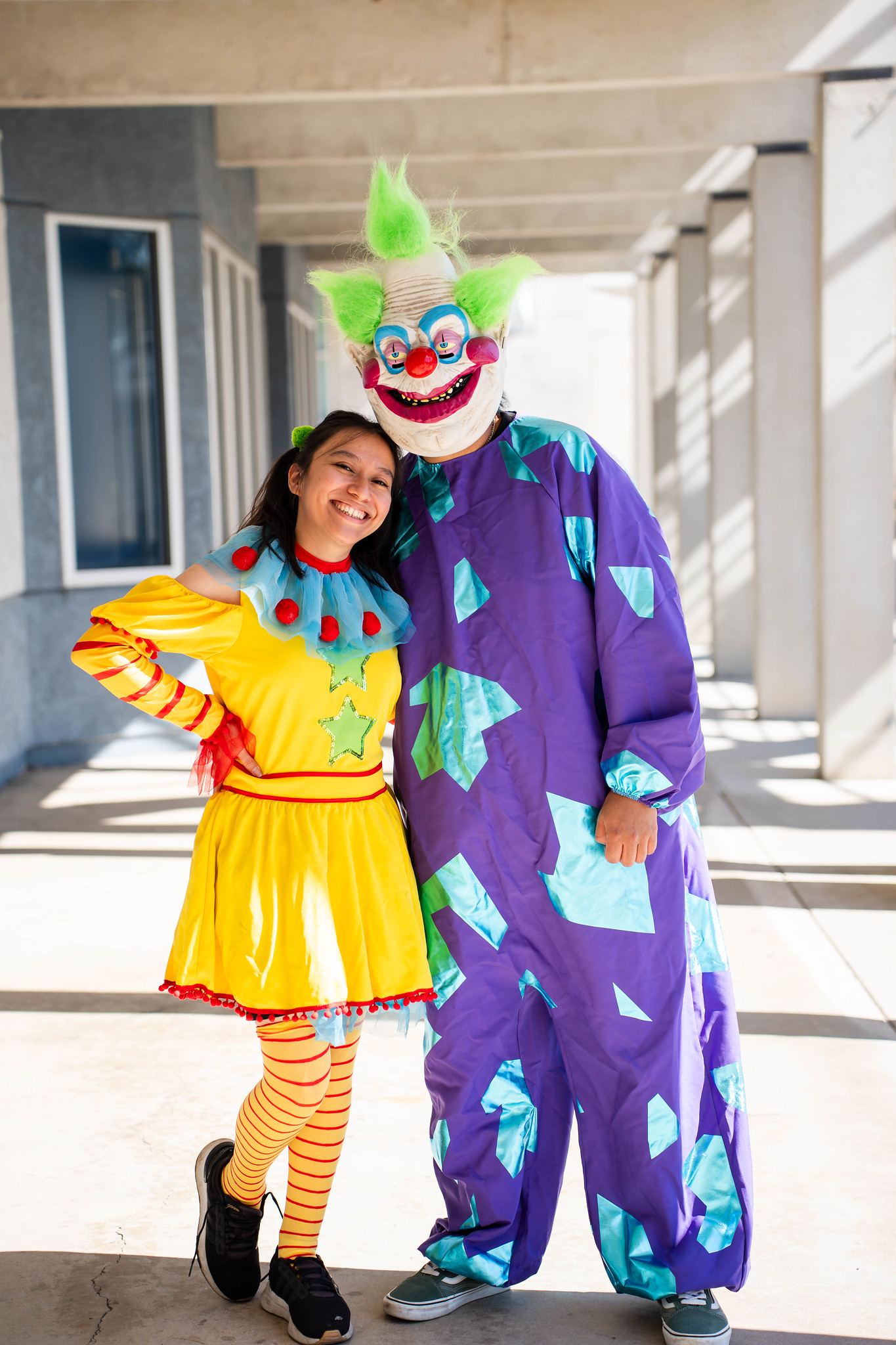 
Two people dressed as clowns.
