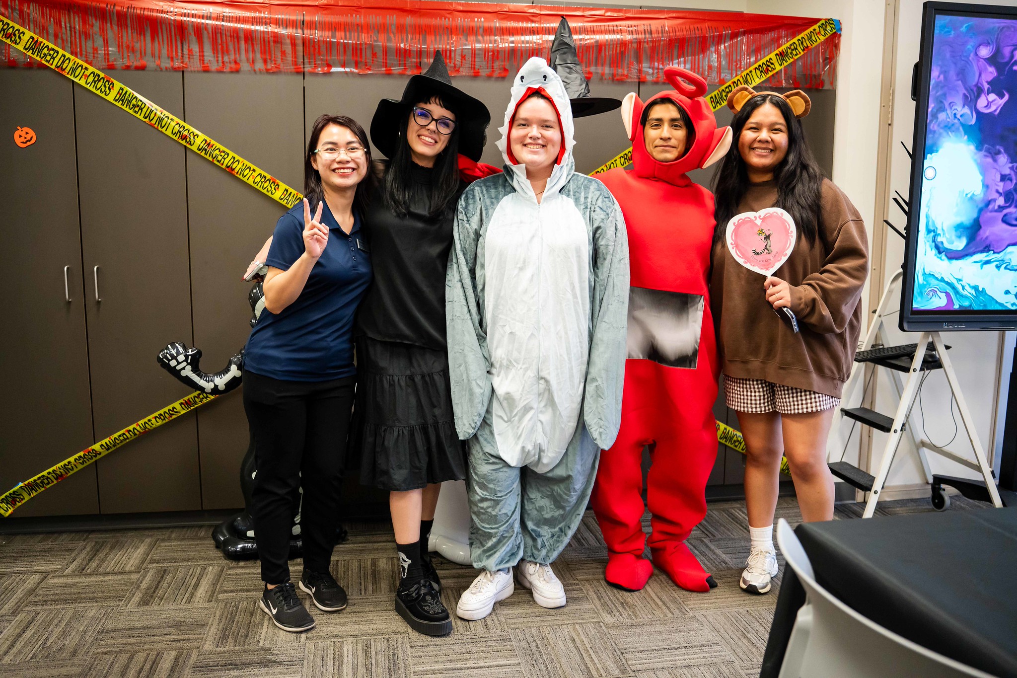 
Five people wearning Halloween costumes
