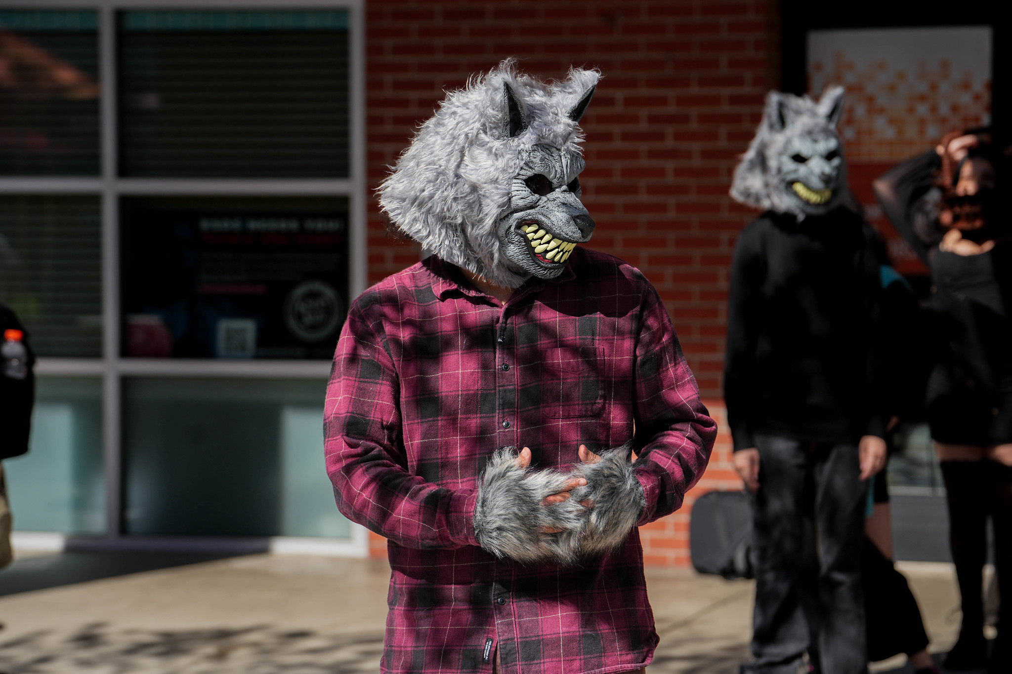 
Two people dressed as wolves.&nbsp;
