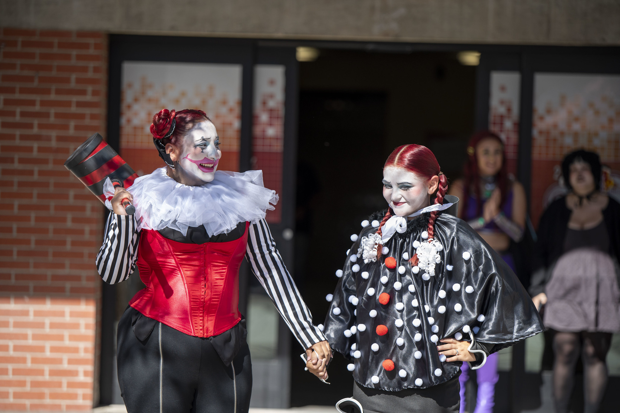 
Two ladies dressed as clowns.
