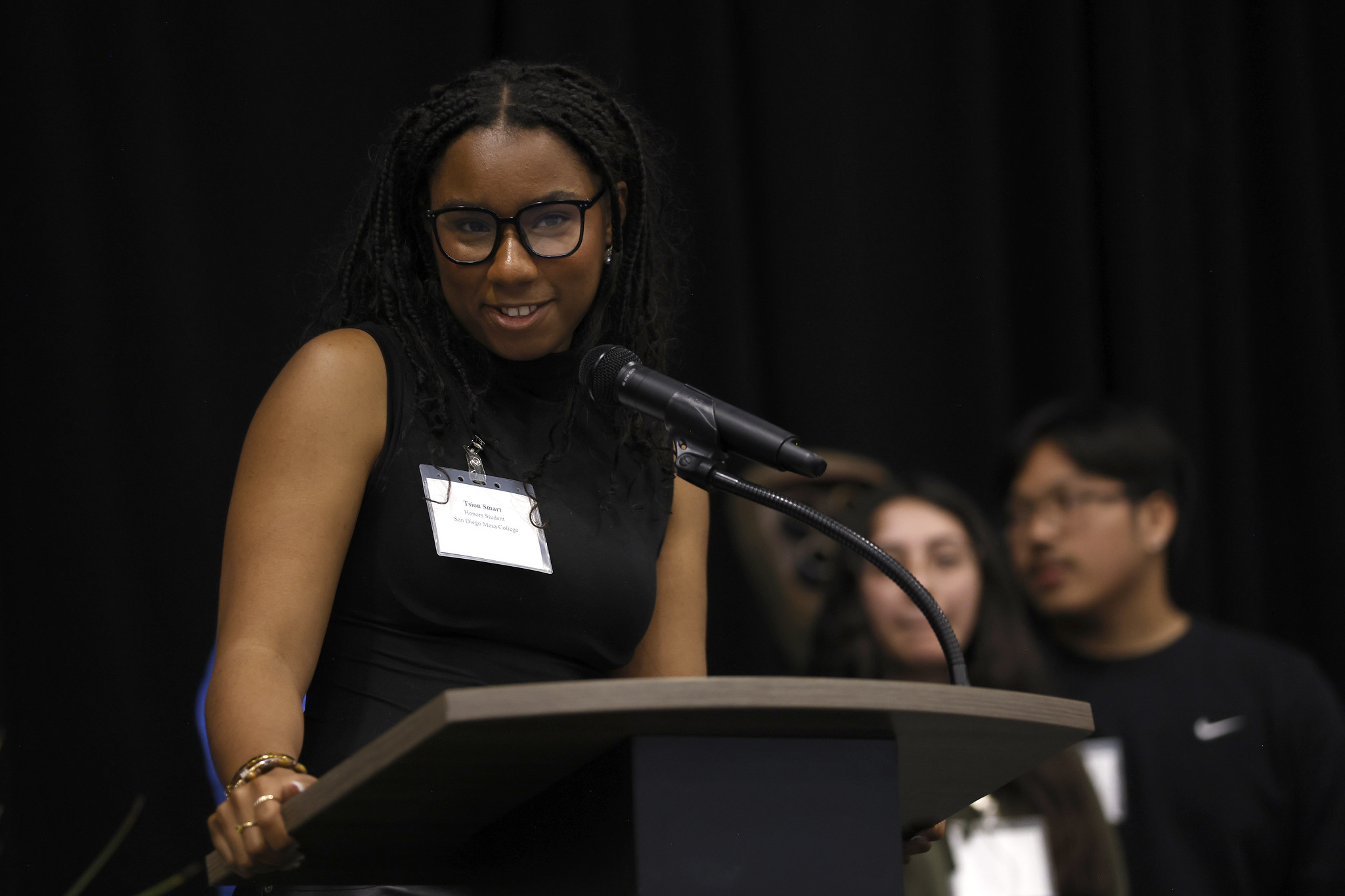 
A student speaks at a podium.
