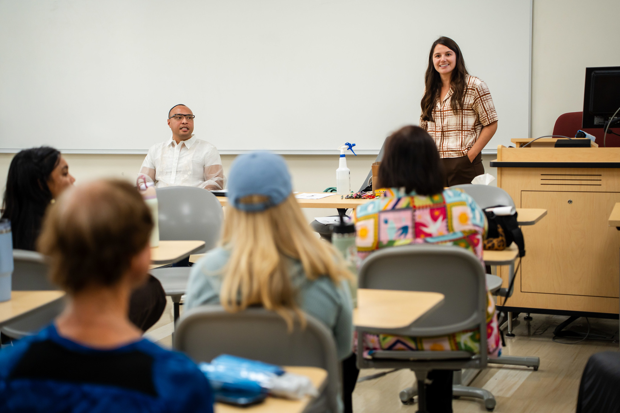 
An instructor speaks to a classroom of people.
