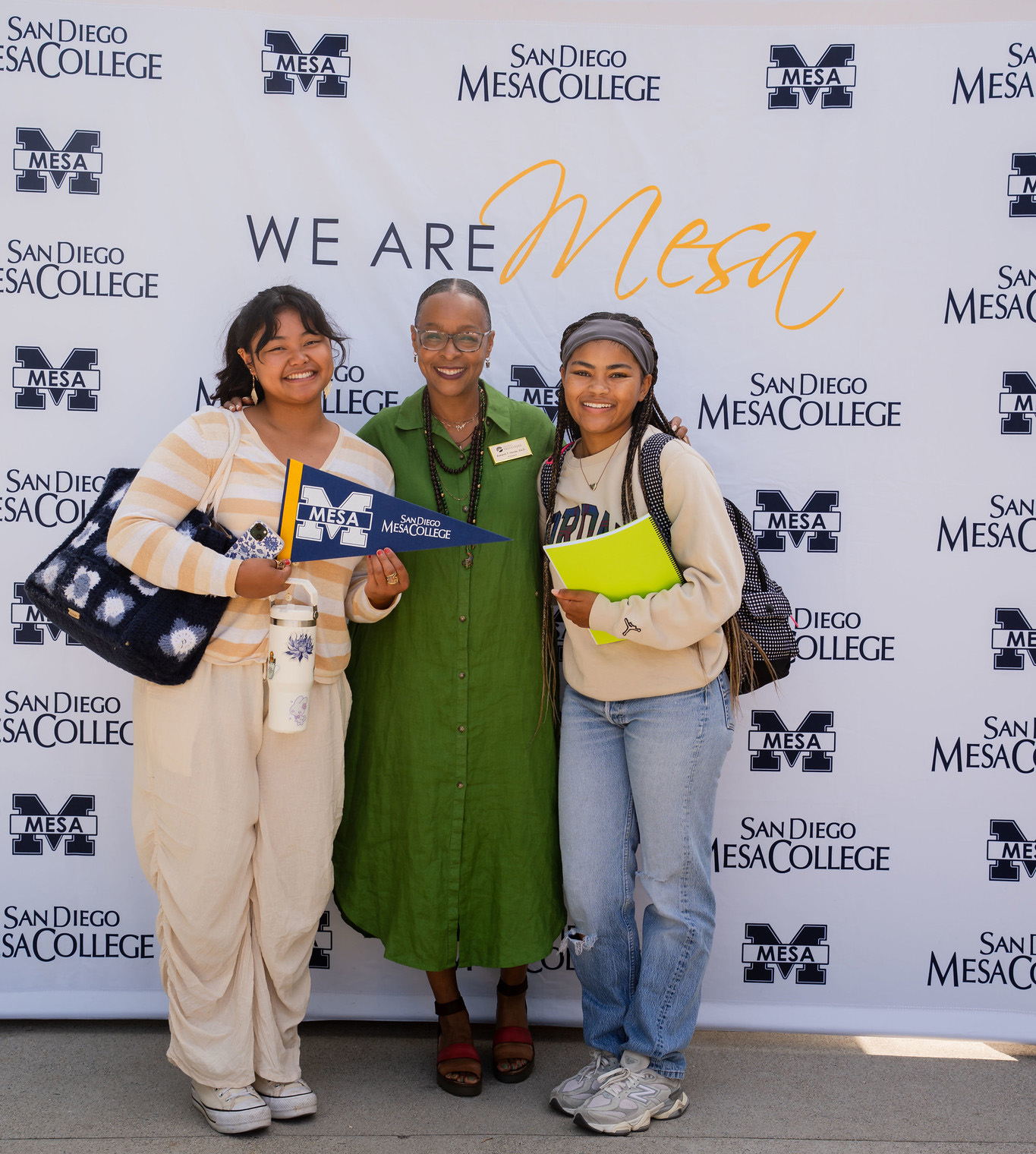 
Mesa College President Ashanti Hands with two students during the first week of the fall semester.
