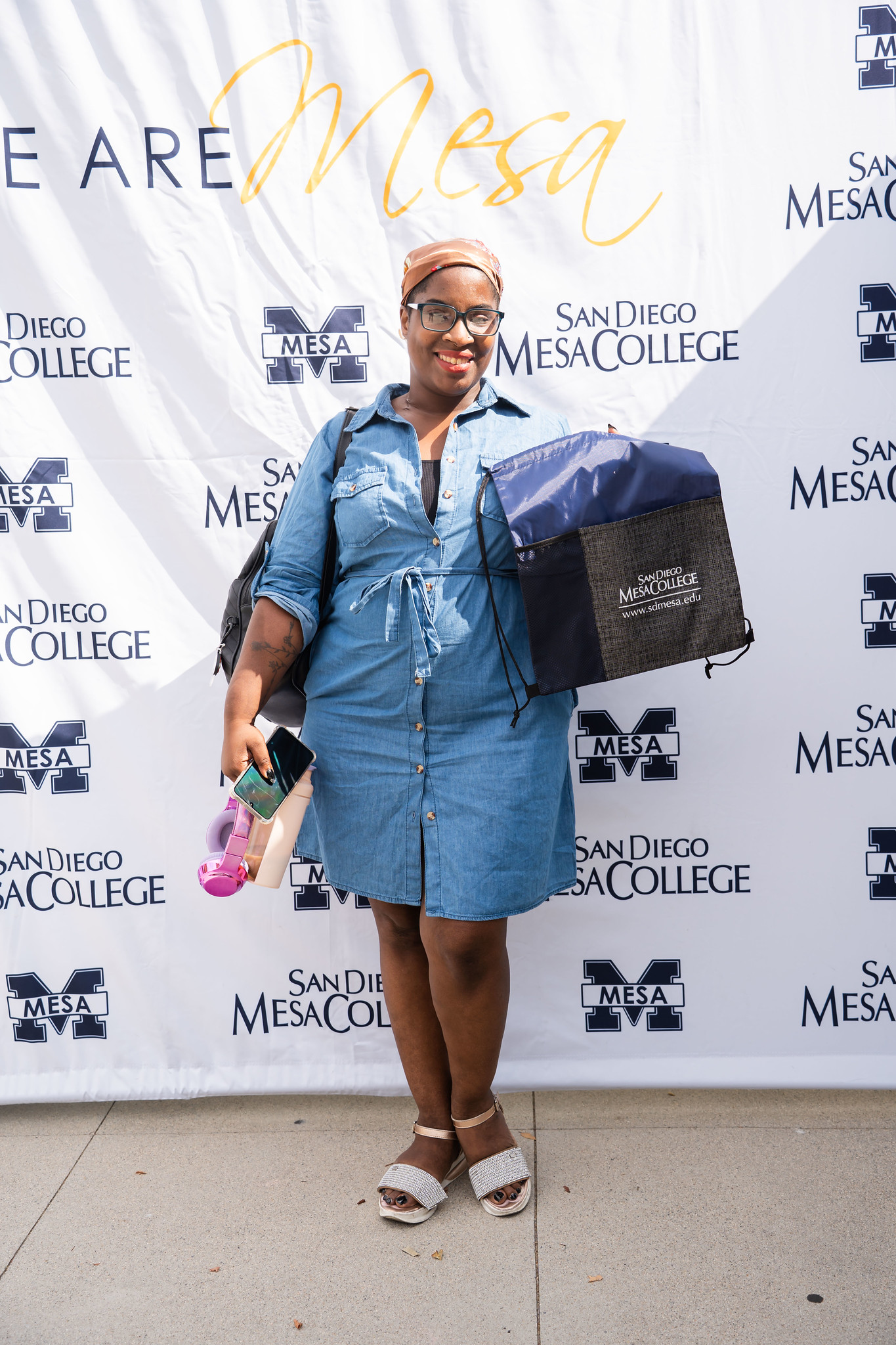 
A student poses with a Mesa College cooler that she won.
