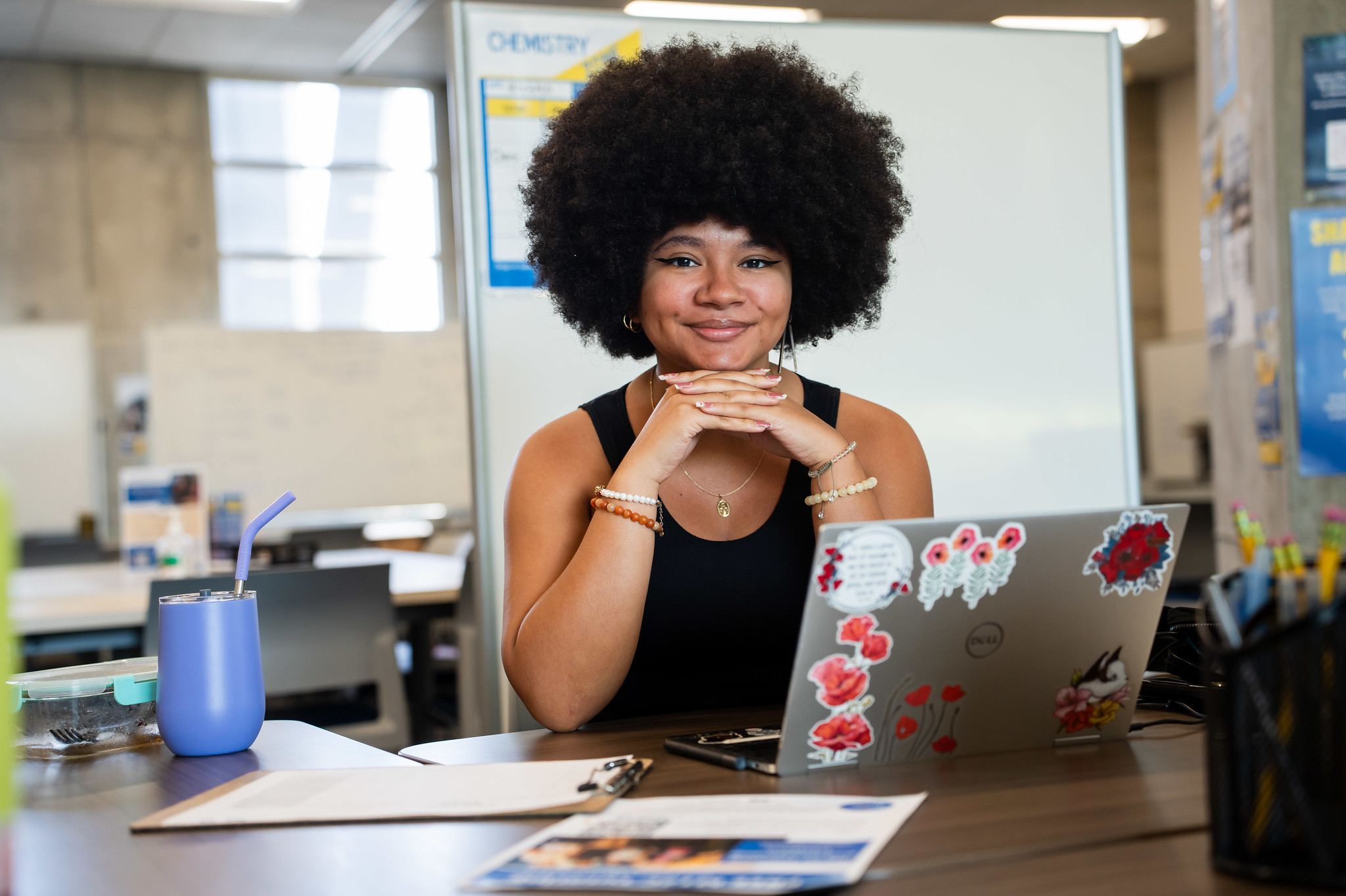 
A lady at a desk working on a laptop
