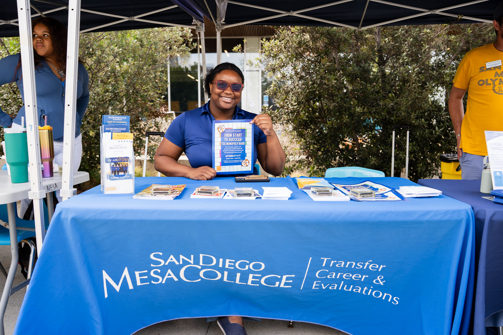 
A lady working at the transfer welcome tent. 
