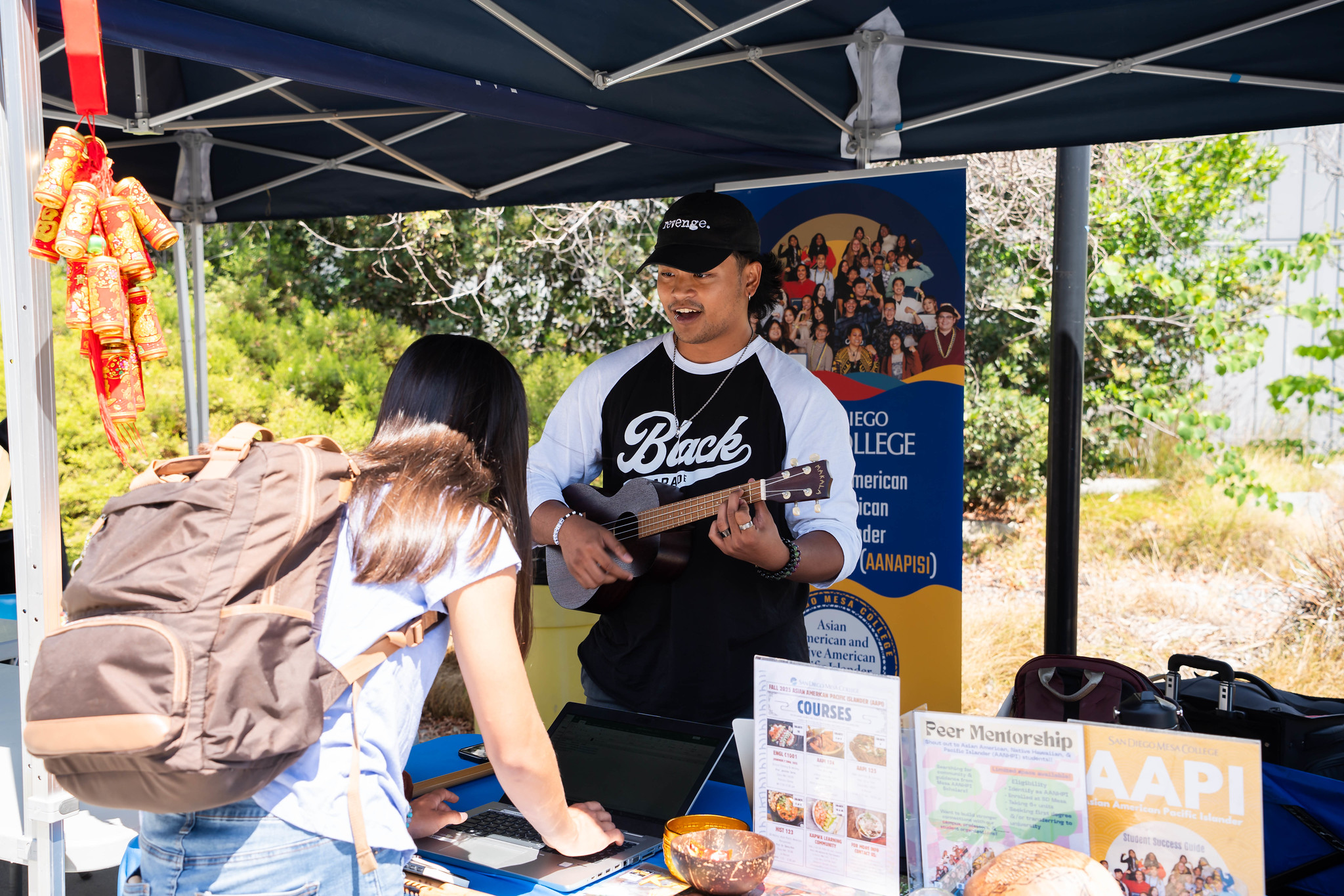 
A student stops by the Asian American Pacific Islander welcome tent.
