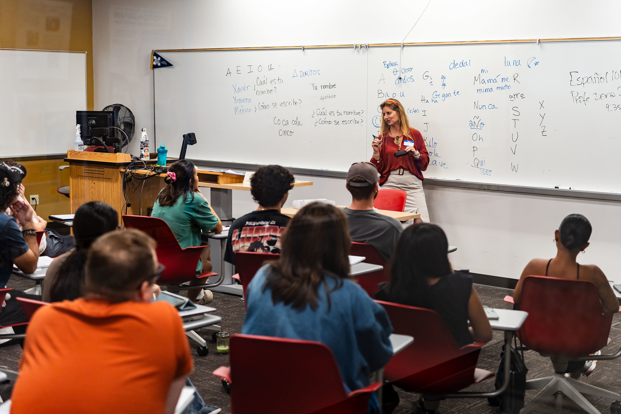 
An instructor speaking to students in class.
