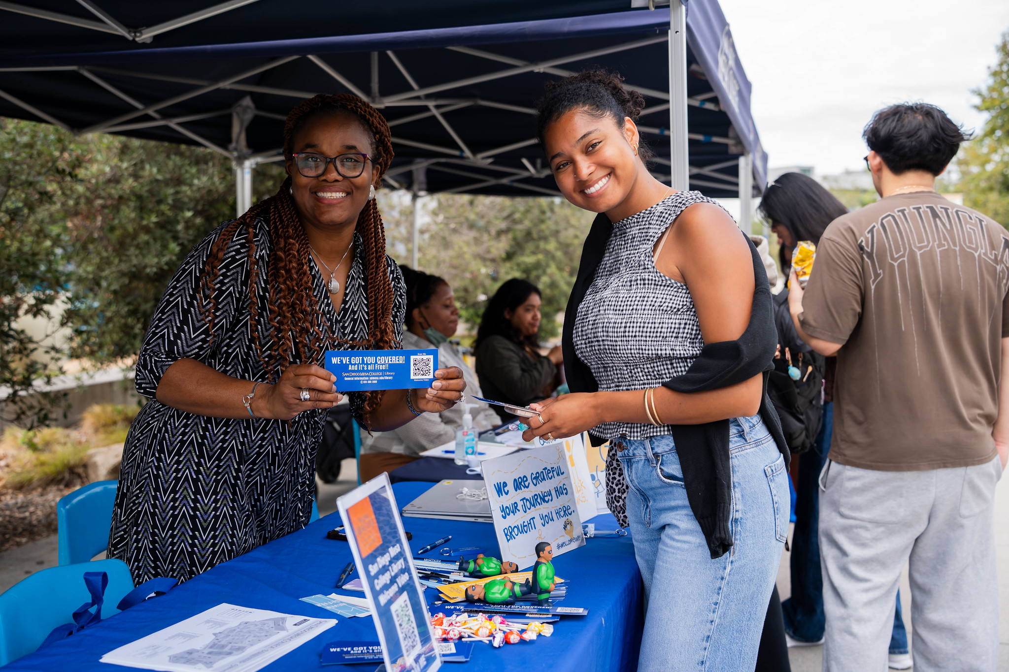
A student and an employee at the welcome tent. 
