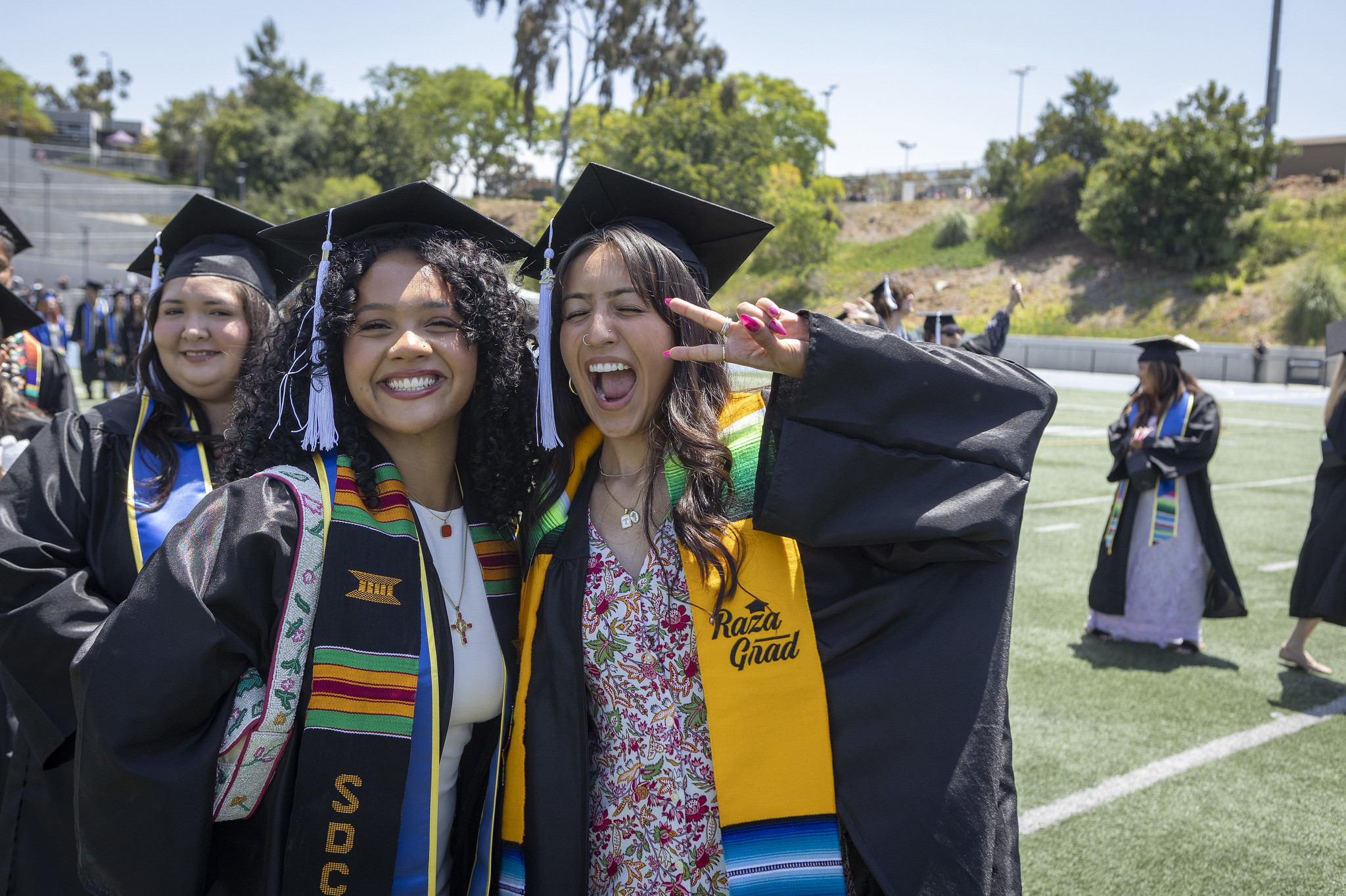 
Two graduates cheer at the Mesa College commencement.
