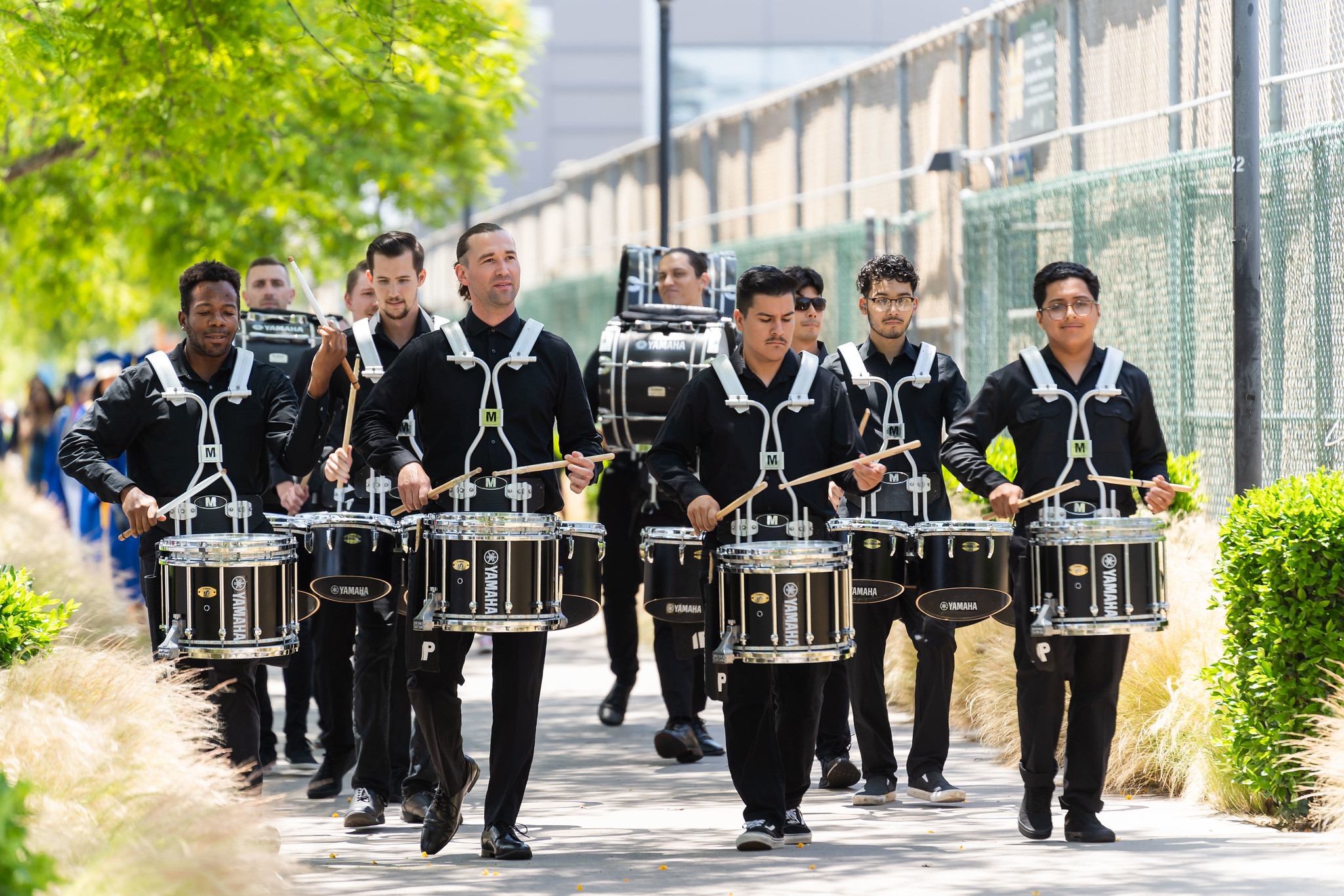 
The drum team marches into the commencement ceremony to perform.

