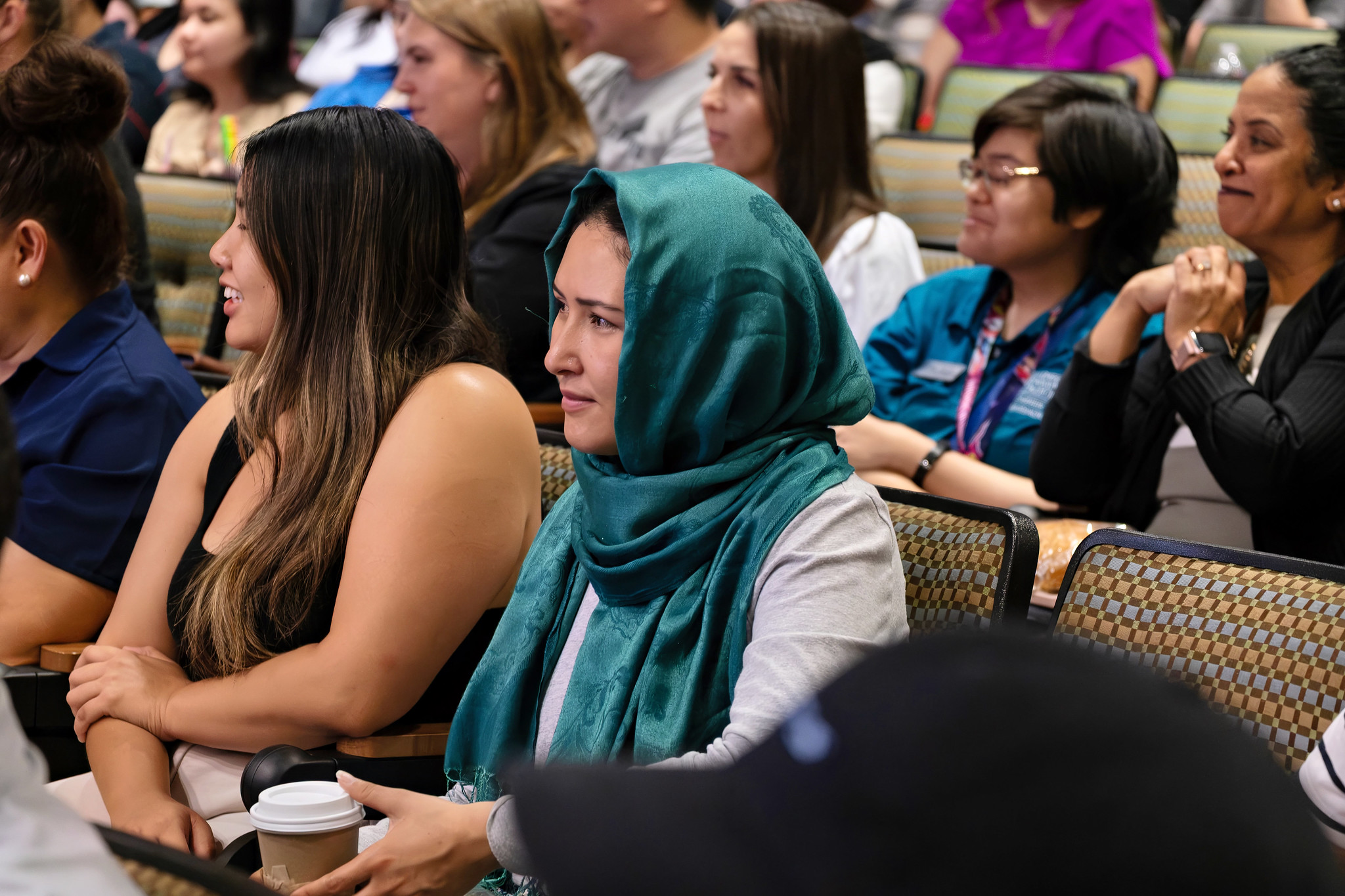 
The audience watches the presentation.
