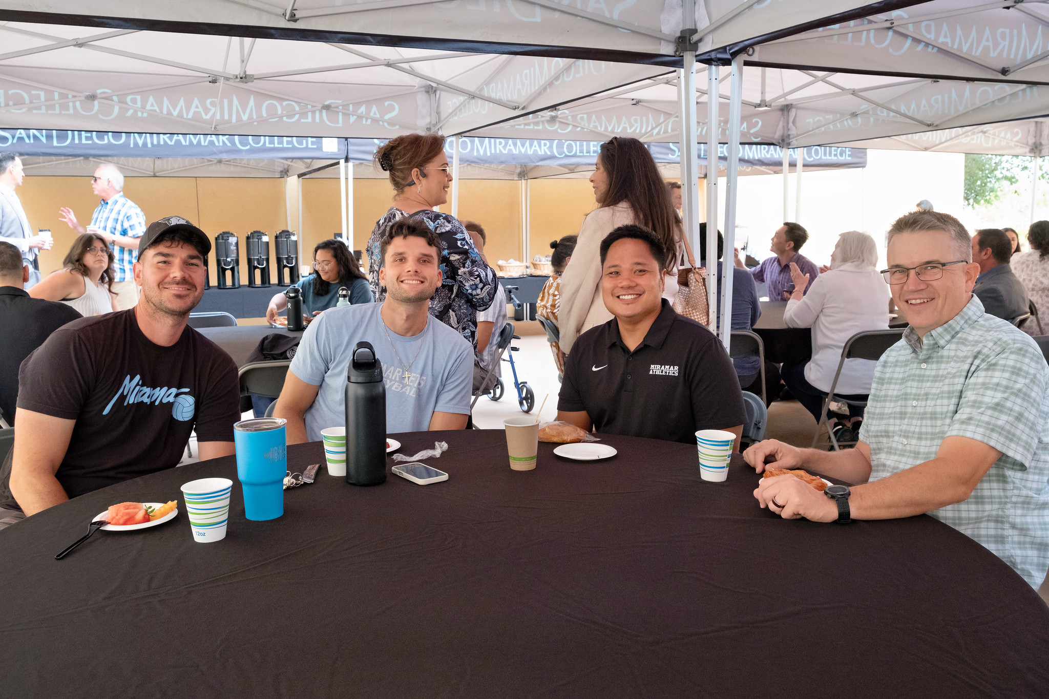 
Five people at a table.
