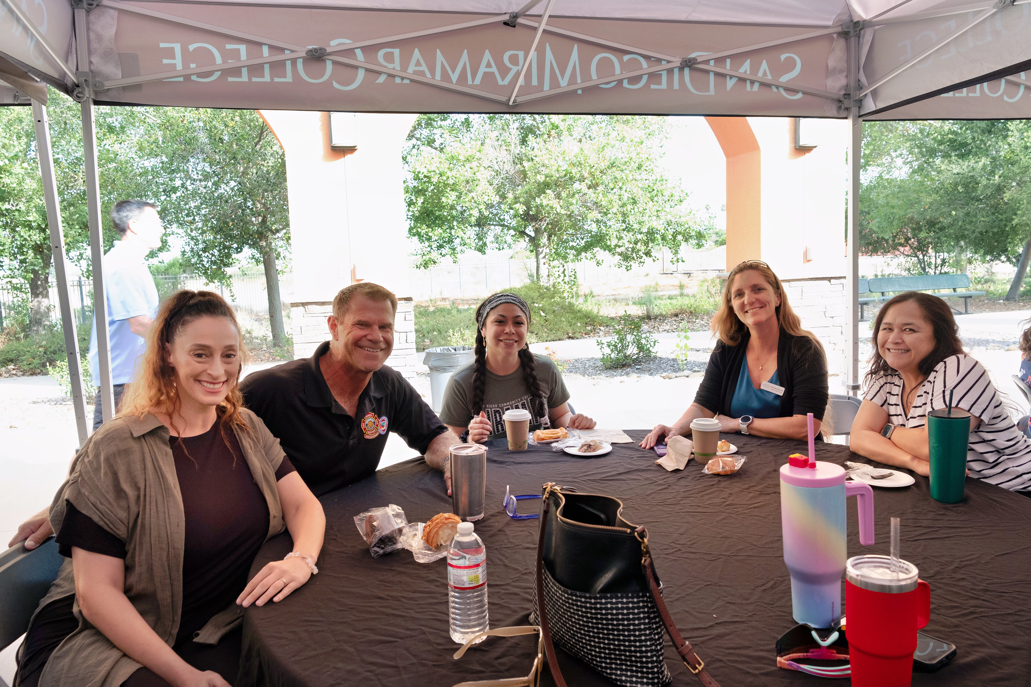 
Five people at a table.
