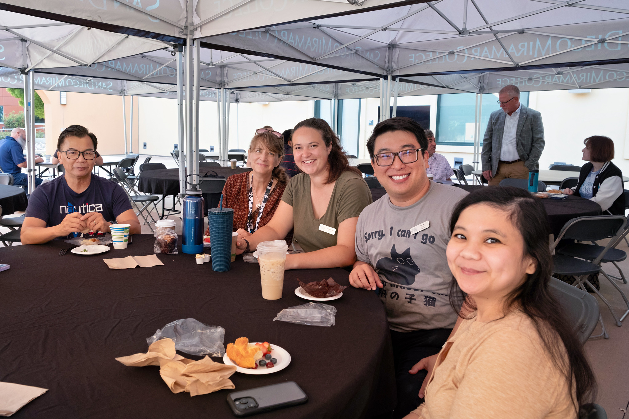 
Five people at a table for lunch at convocation.
