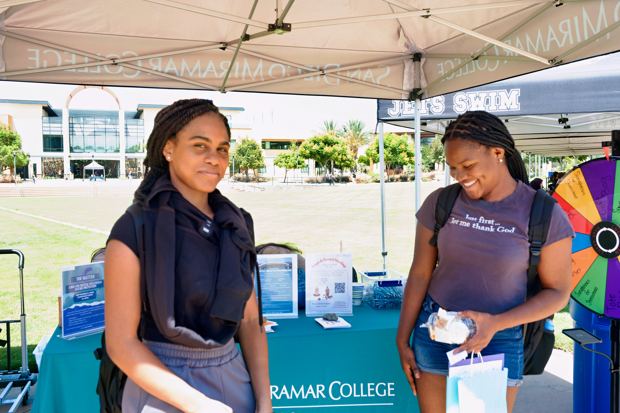 
Two students at a Miramar welcome booth
