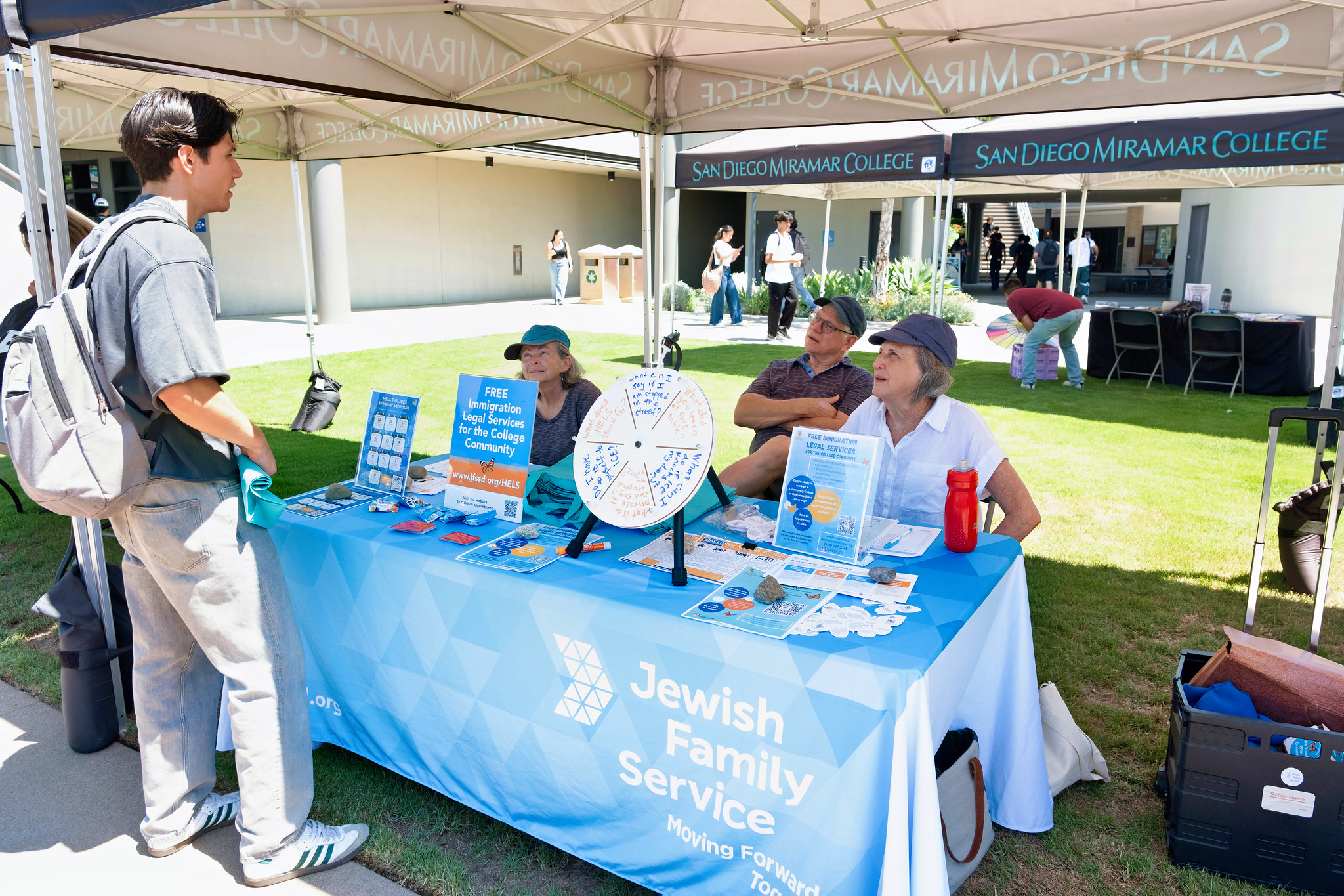
Two people working at the Jewish Family Service booth
