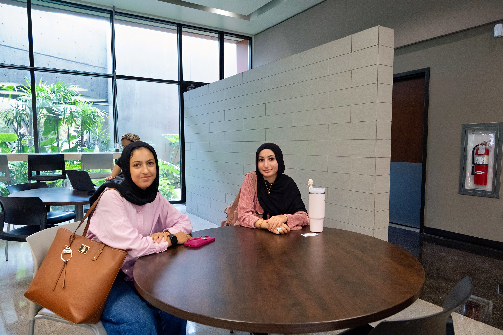 
Two students sitting at a table.
