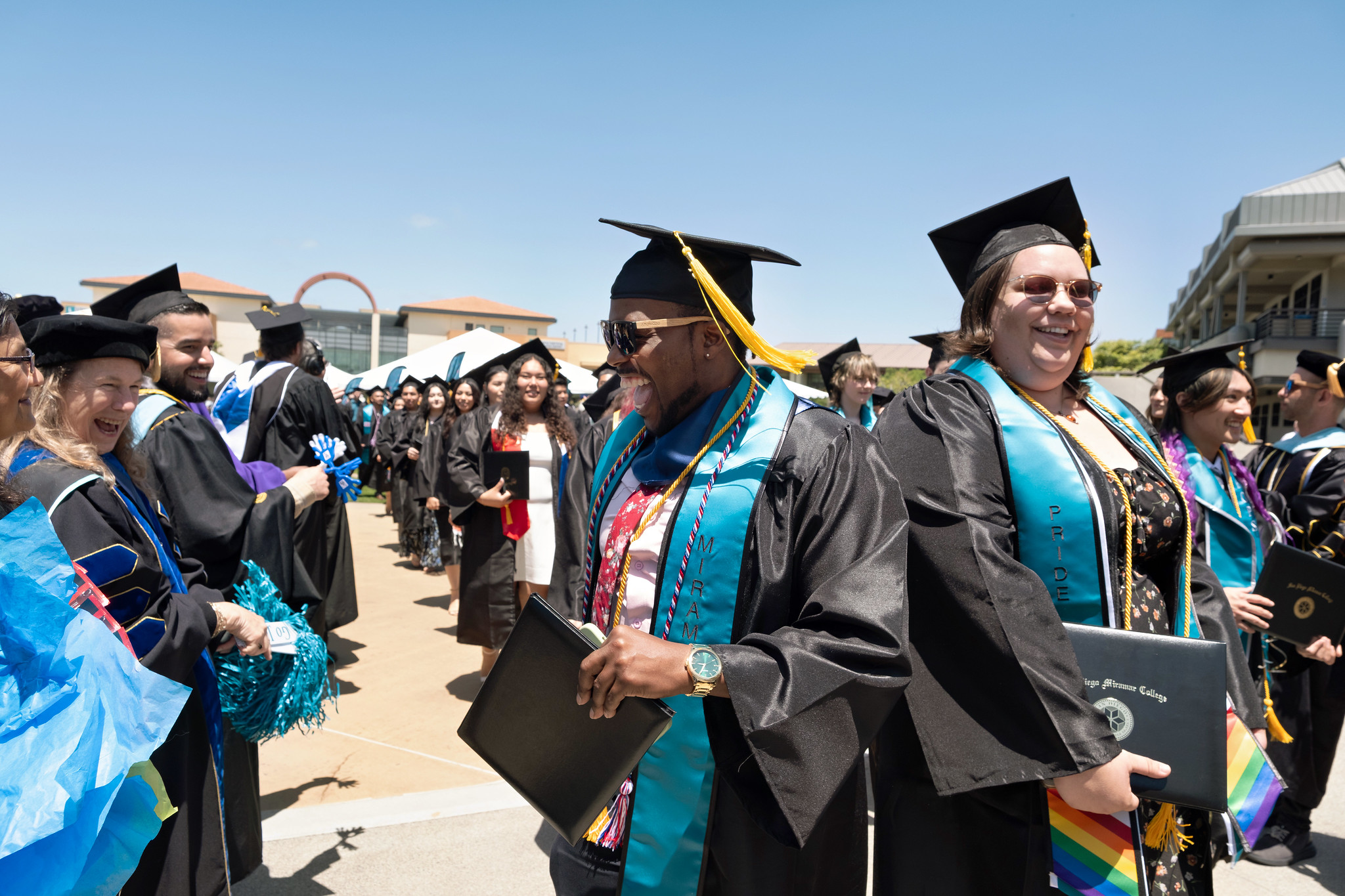 
Faculty in two lines leaving commencement.

