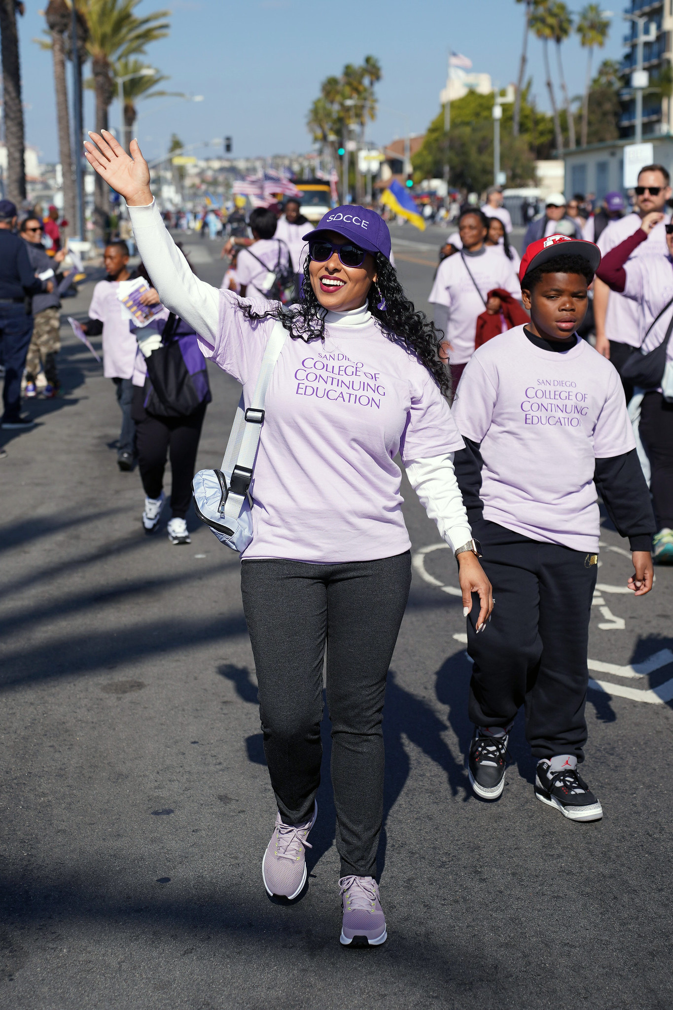 College of Continuing Education President Tina King waves while walking in the parade.