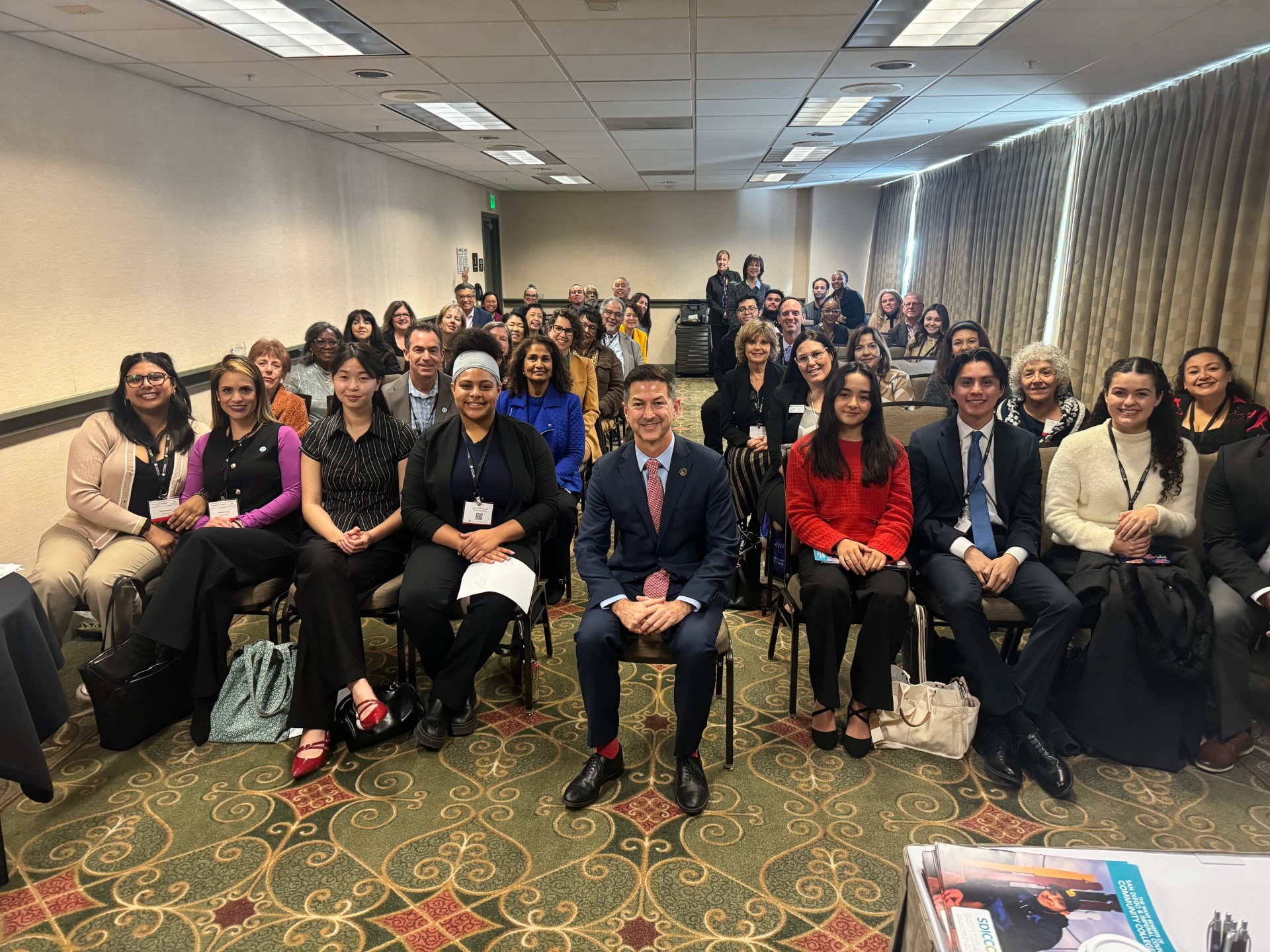 
District leaders attend a meeting with Assembly member Chris Ward.
