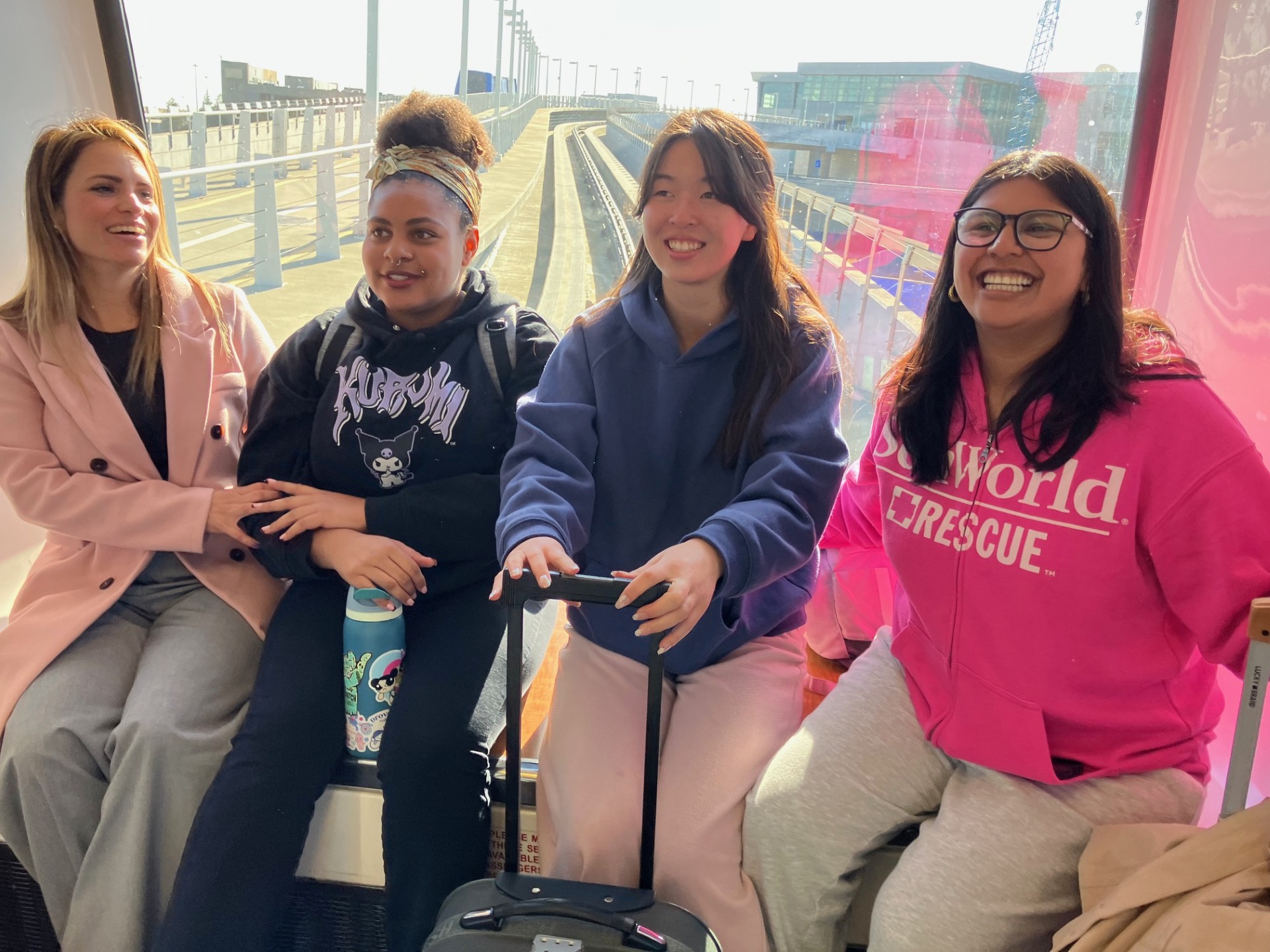 
Four student trustees on a train.
