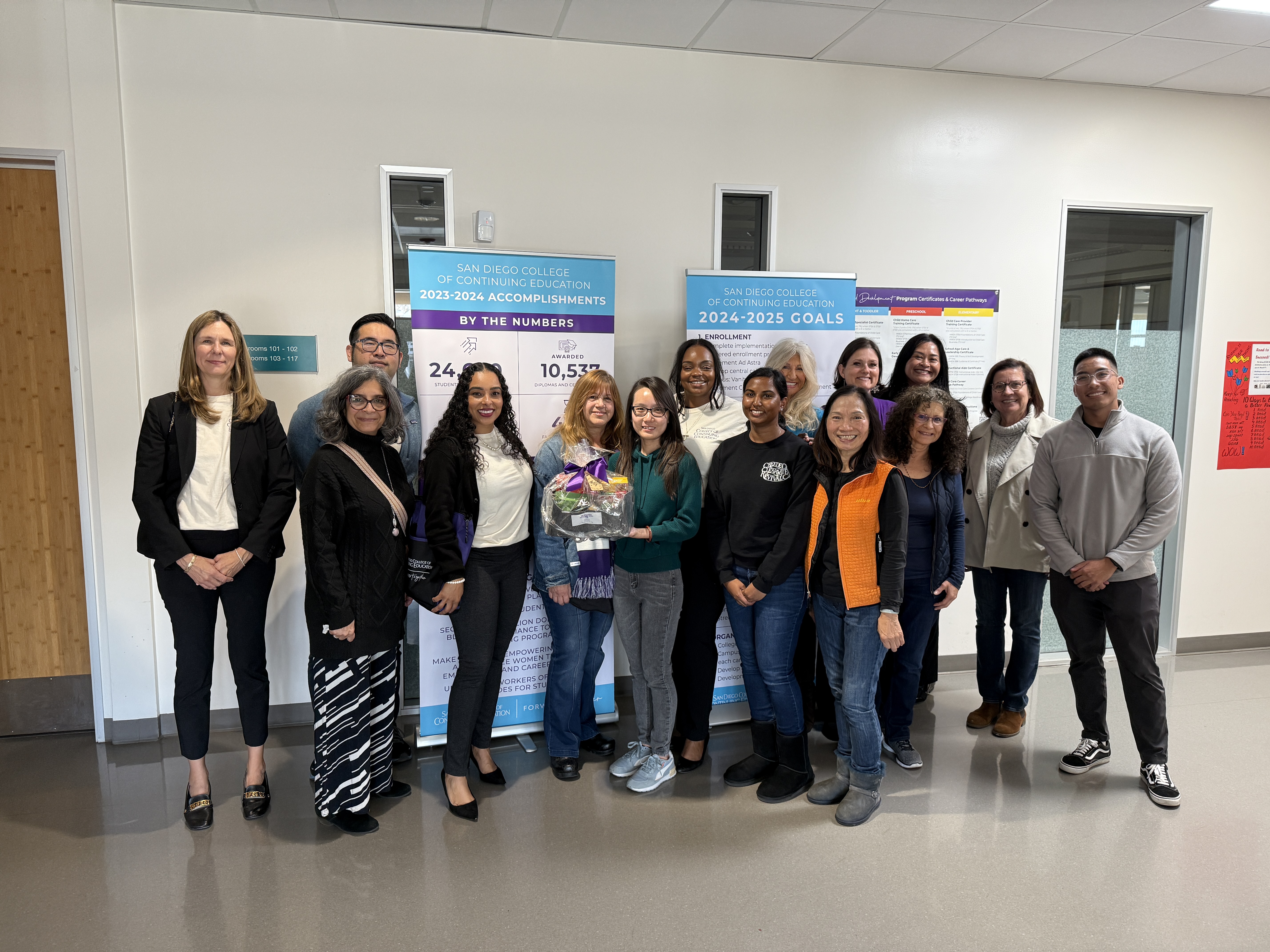 
College of Continuing Education President Tina King gives a welcome basket to 14 employees at one of the college's seven campuses.
