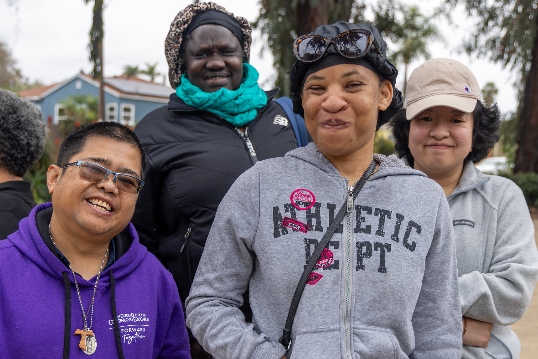 
Four people at a College of Continuing Education event at the Educational Cultural Complex.
