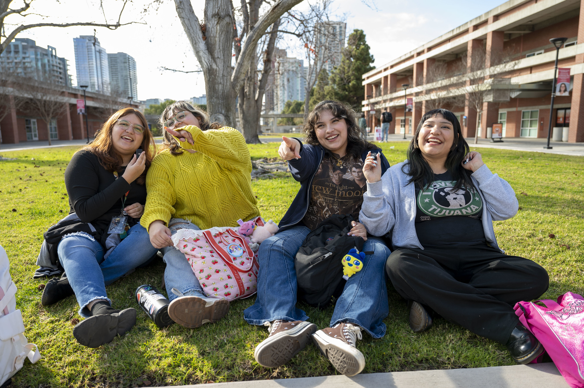 
Four students hanging on the lawn out at City College.

