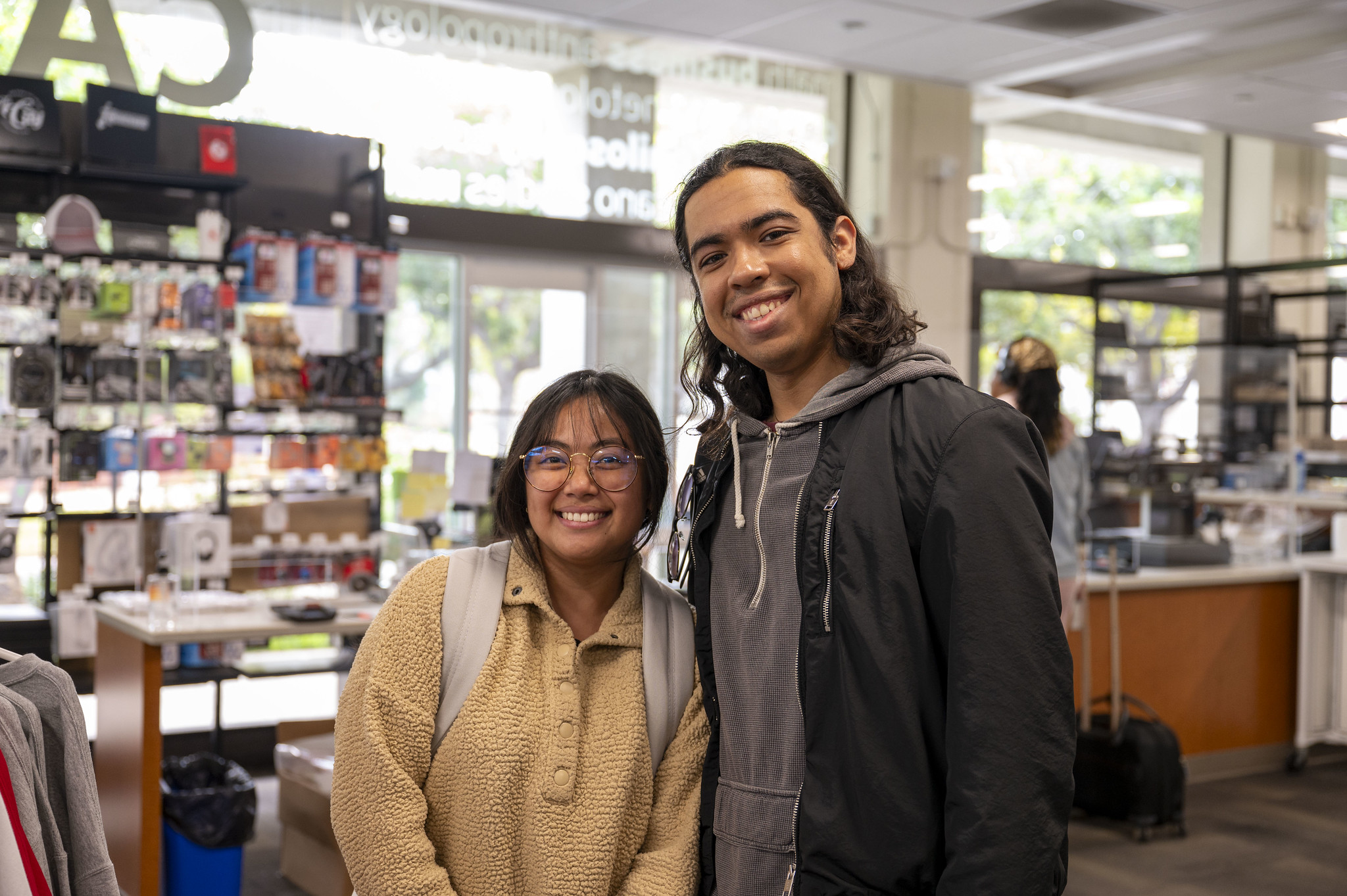 
Two students wearing backpacks in the bookstore at City College.
