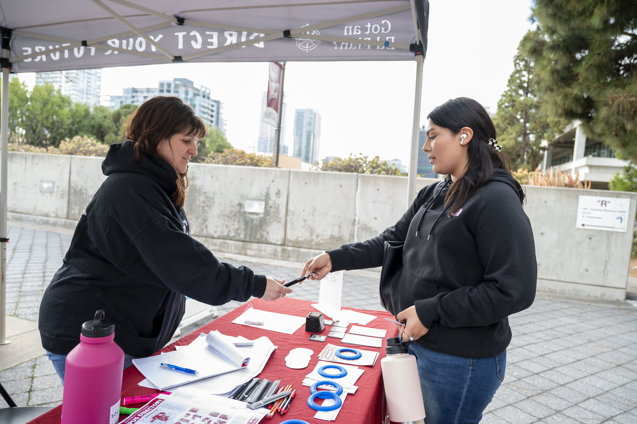 
A student stops by a red booth at City College.
