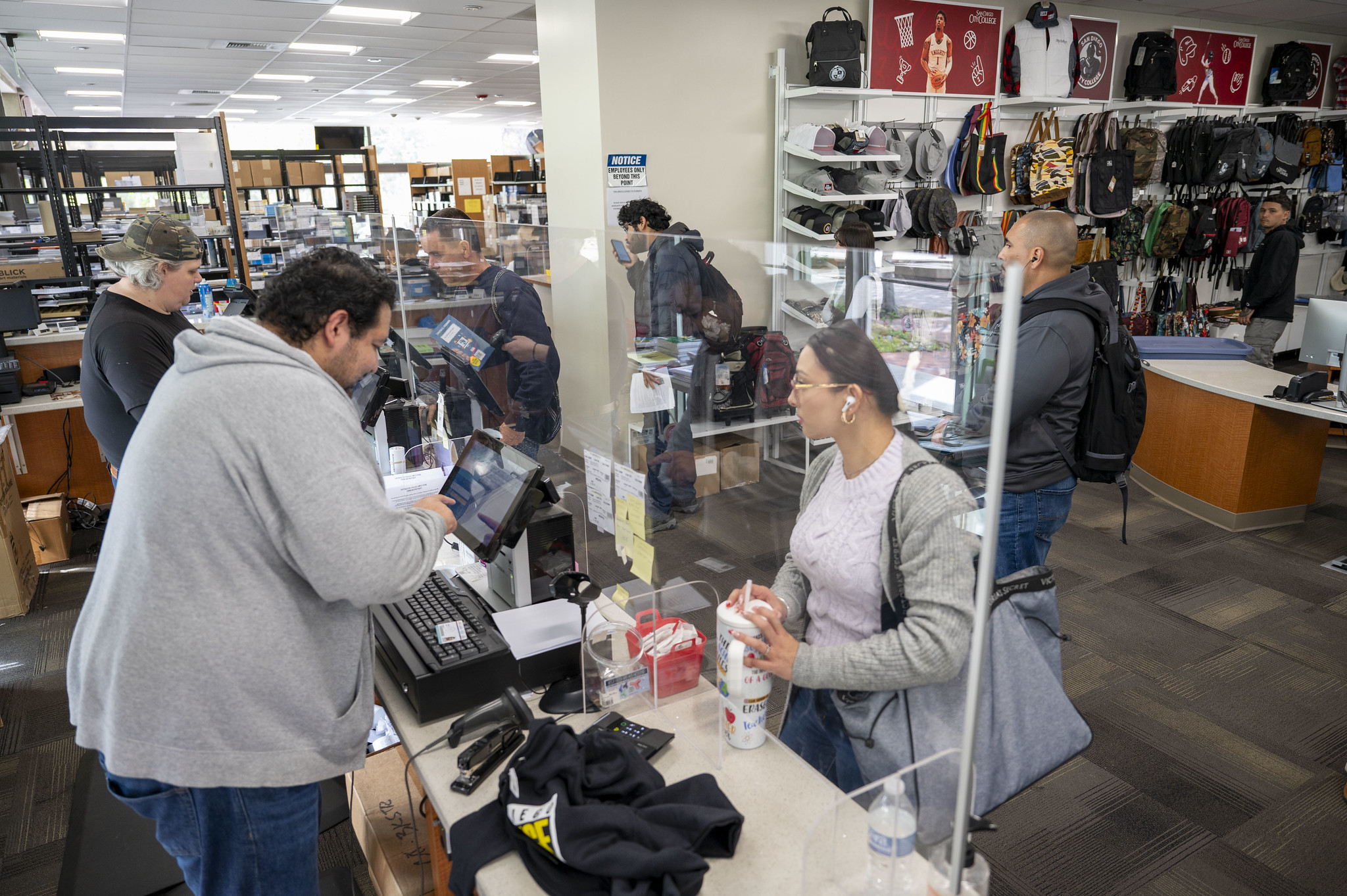 
Workers and students at the City College Bookstore.
