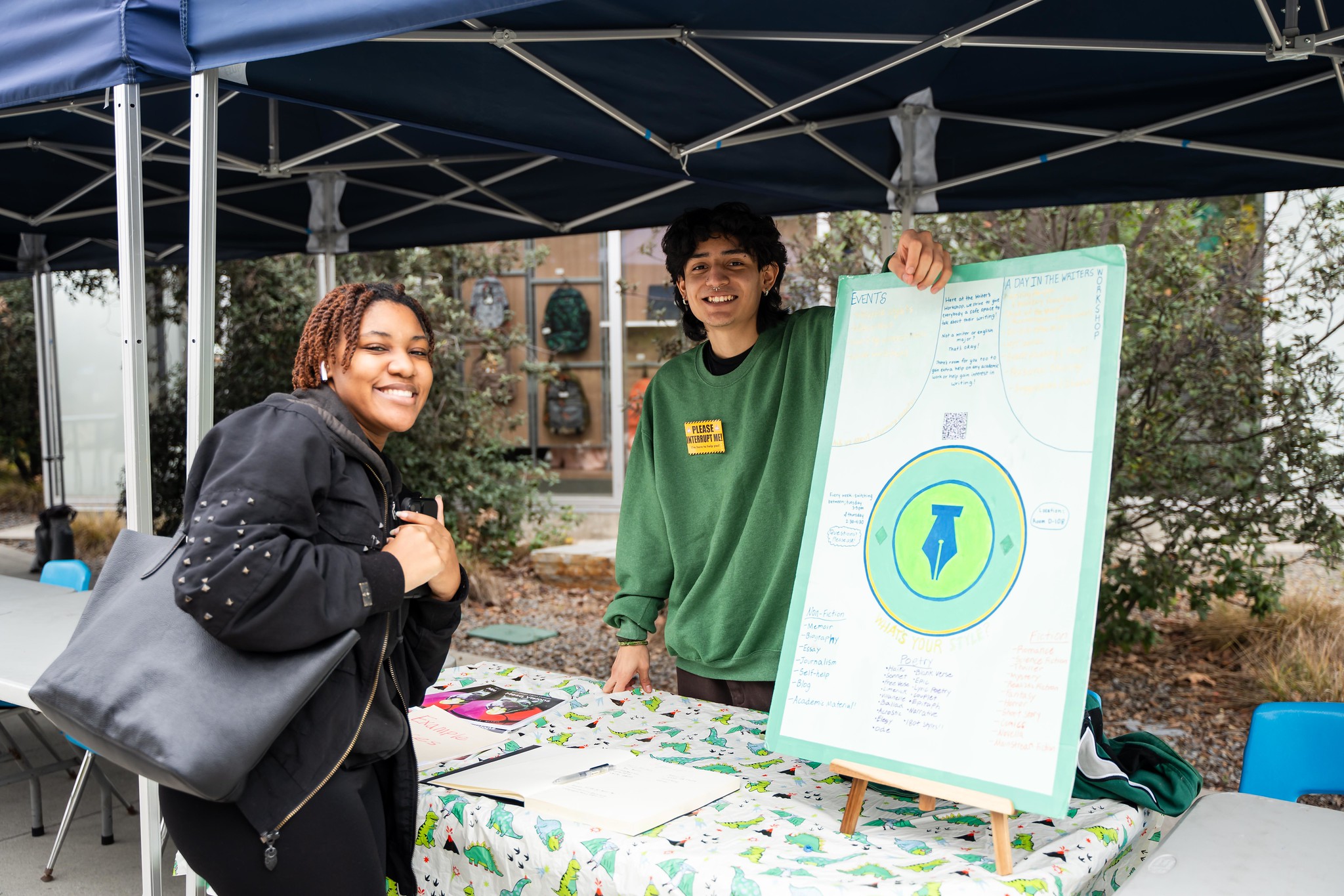 
A student and a worker at a Mesa College booth.
